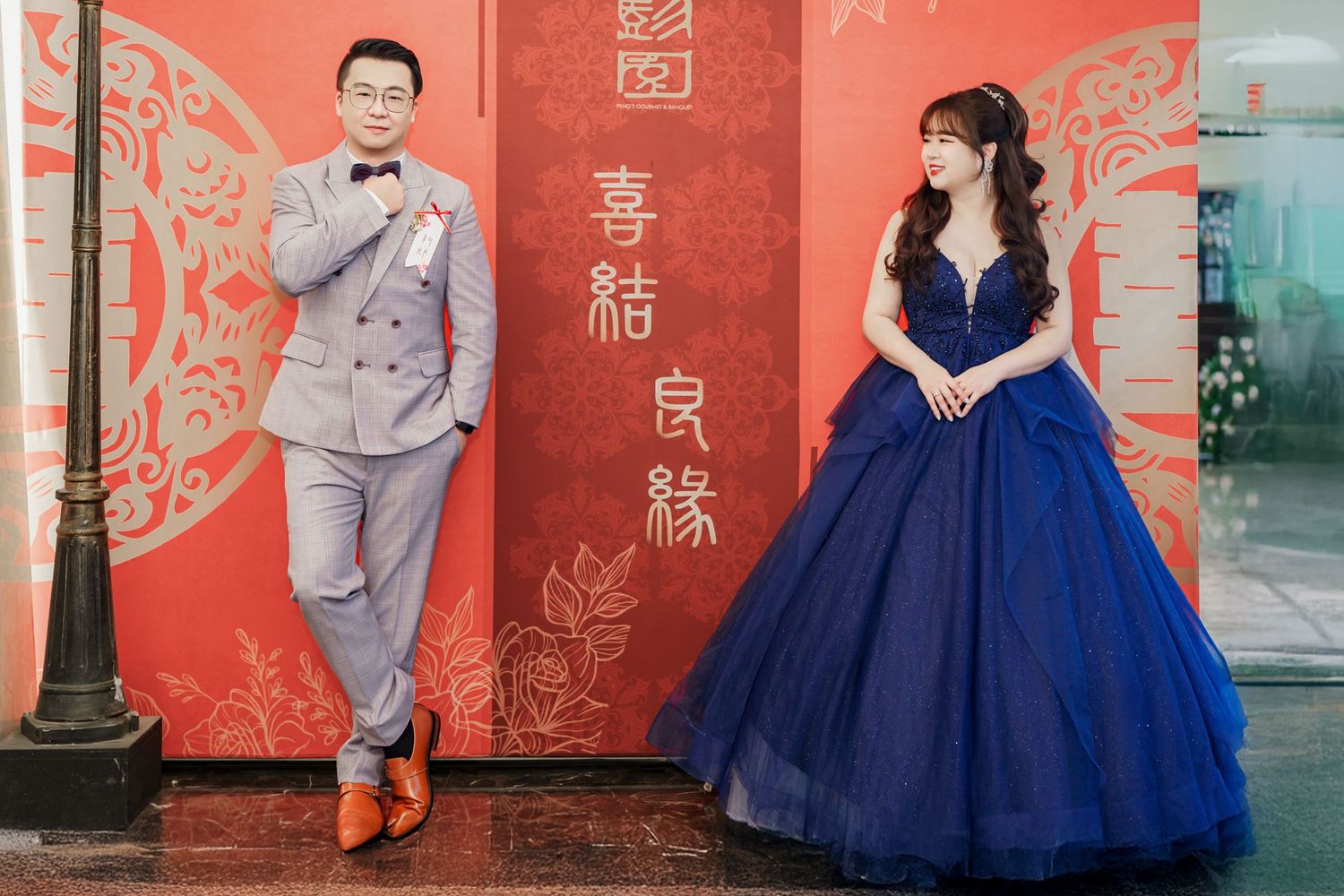 A wedding photo collage showing couples in formal attire with blue gowns and gray suits against red Chinese-themed backgrounds.