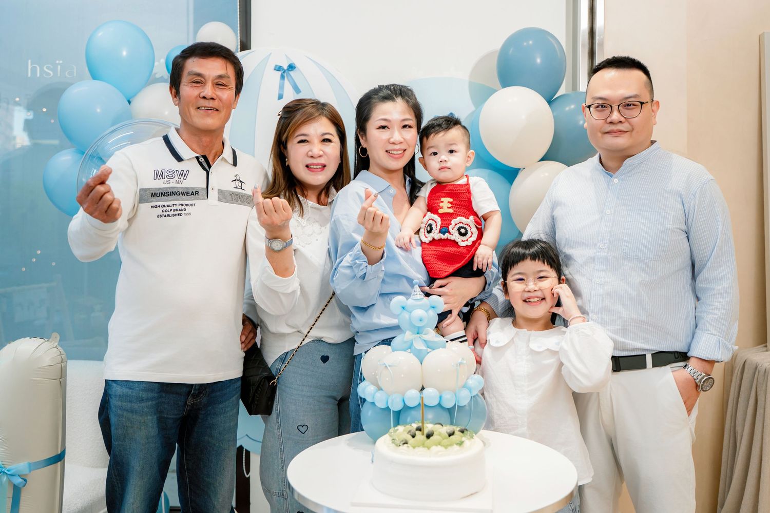 A series of family photos with blue balloons showing a birthday celebration and cake cutting moments.