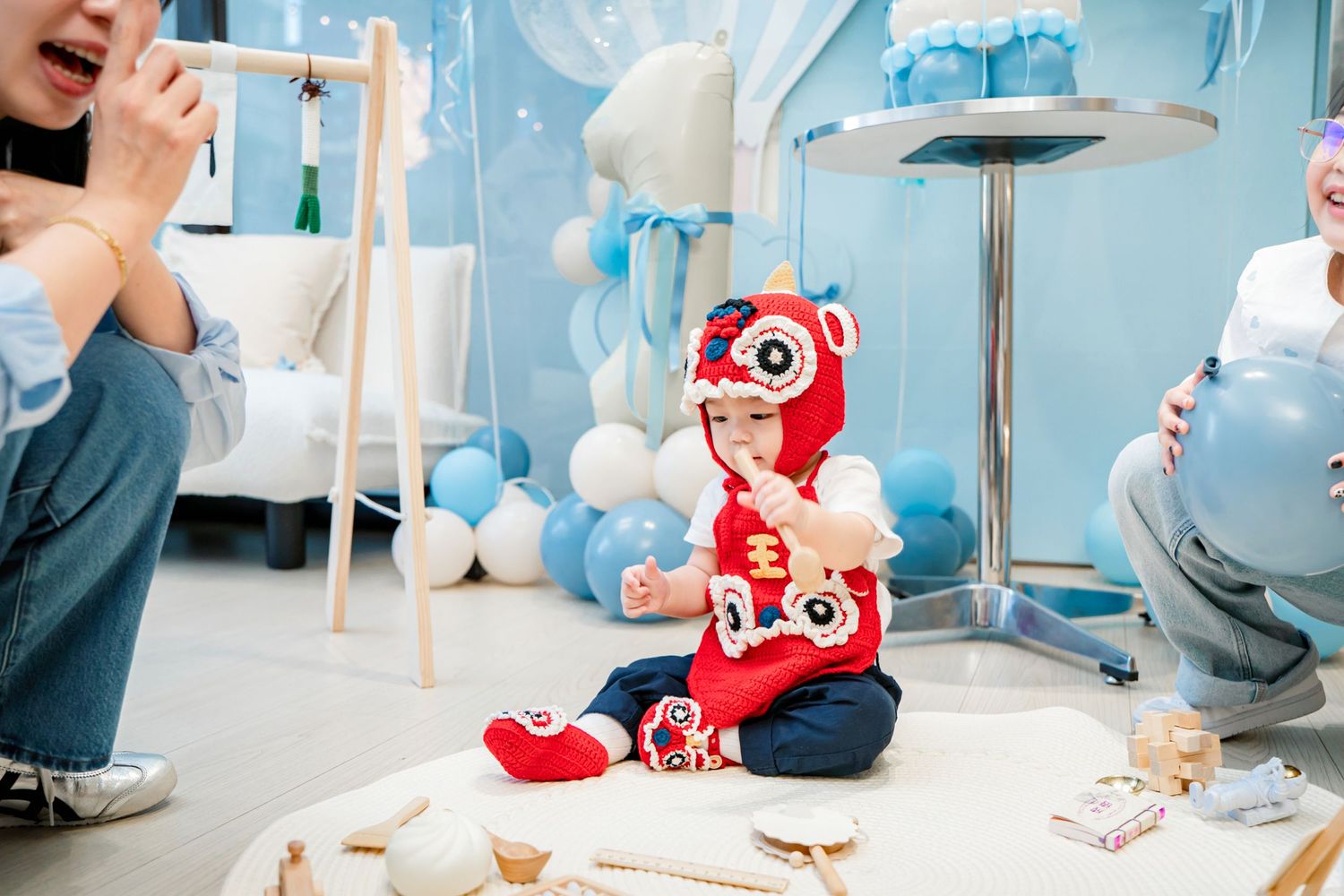 A series of connected photos showing a baby in a red outfit crawling and playing on a light colored floor.