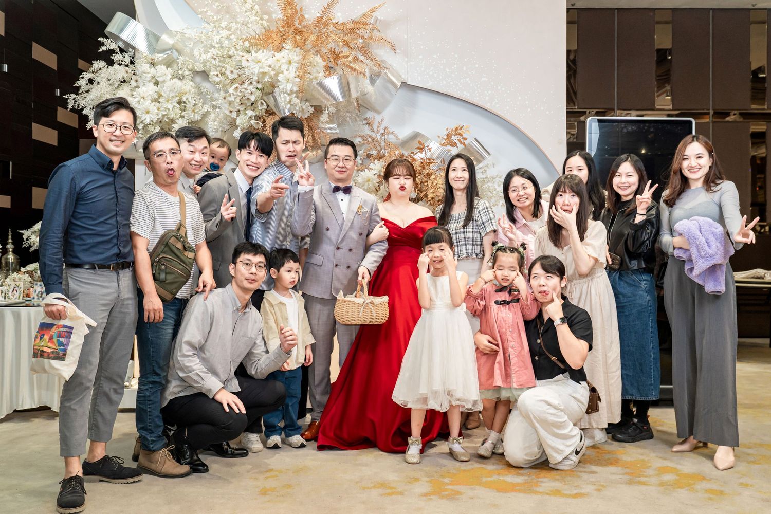 A collage of wedding celebration photos showing groups of guests and attendees posing together at various moments during the event.