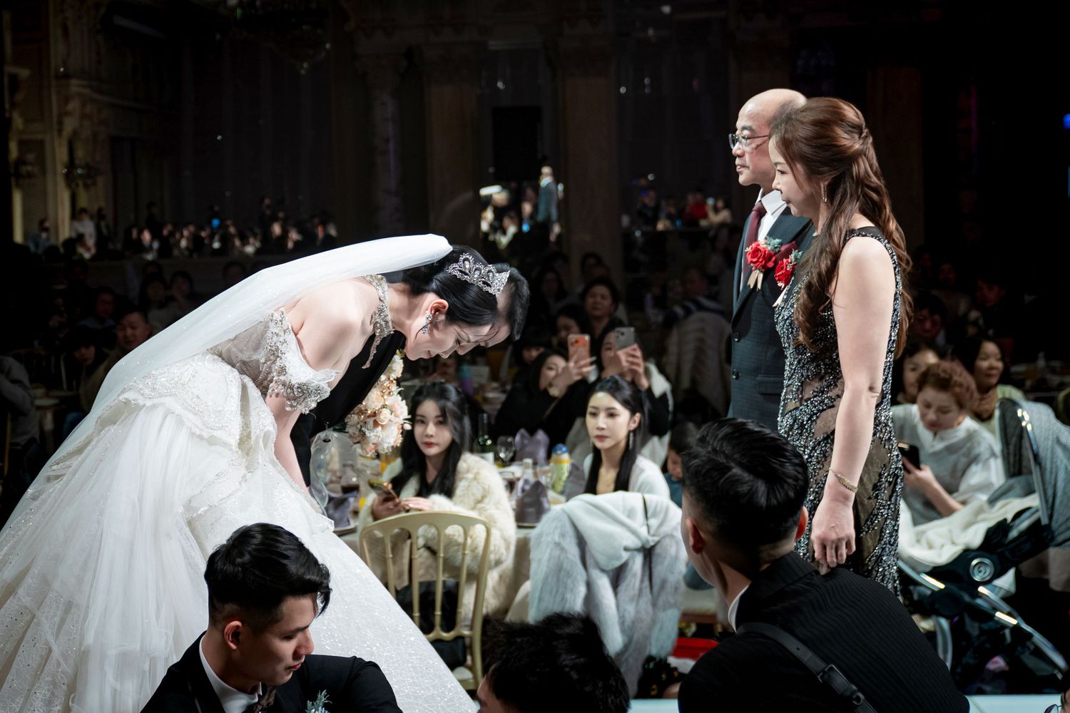 A sequence of wedding photos showing intimate moments between a couple during their celebration.