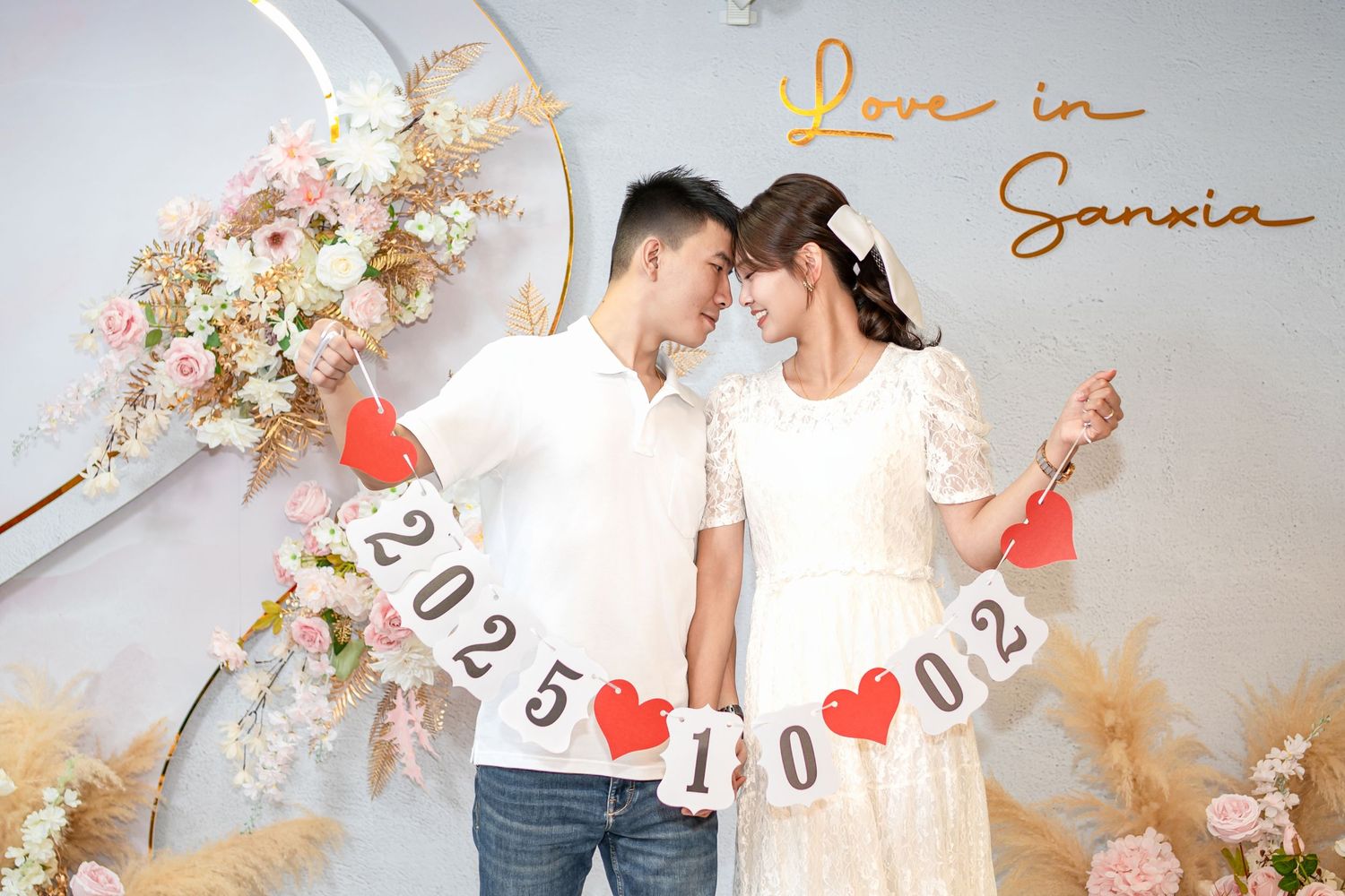 A collage of romantic engagement photos with floral decorations and save the date elements in soft, warm tones.