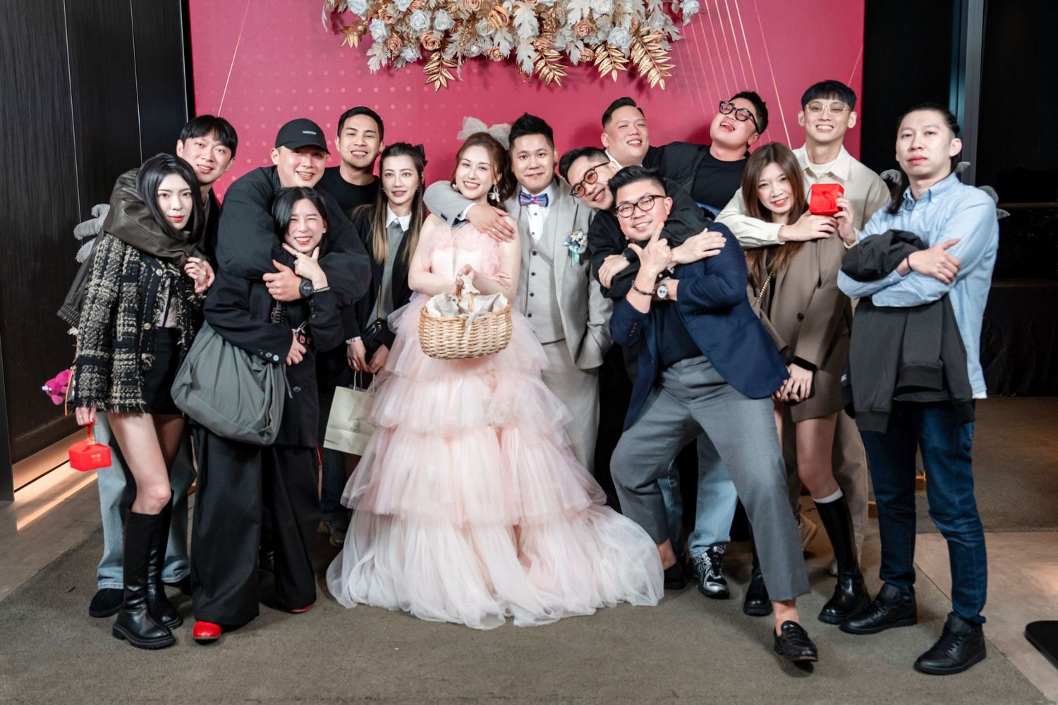 A collage of wedding celebration photos showing groups of guests posing together at a formal event.