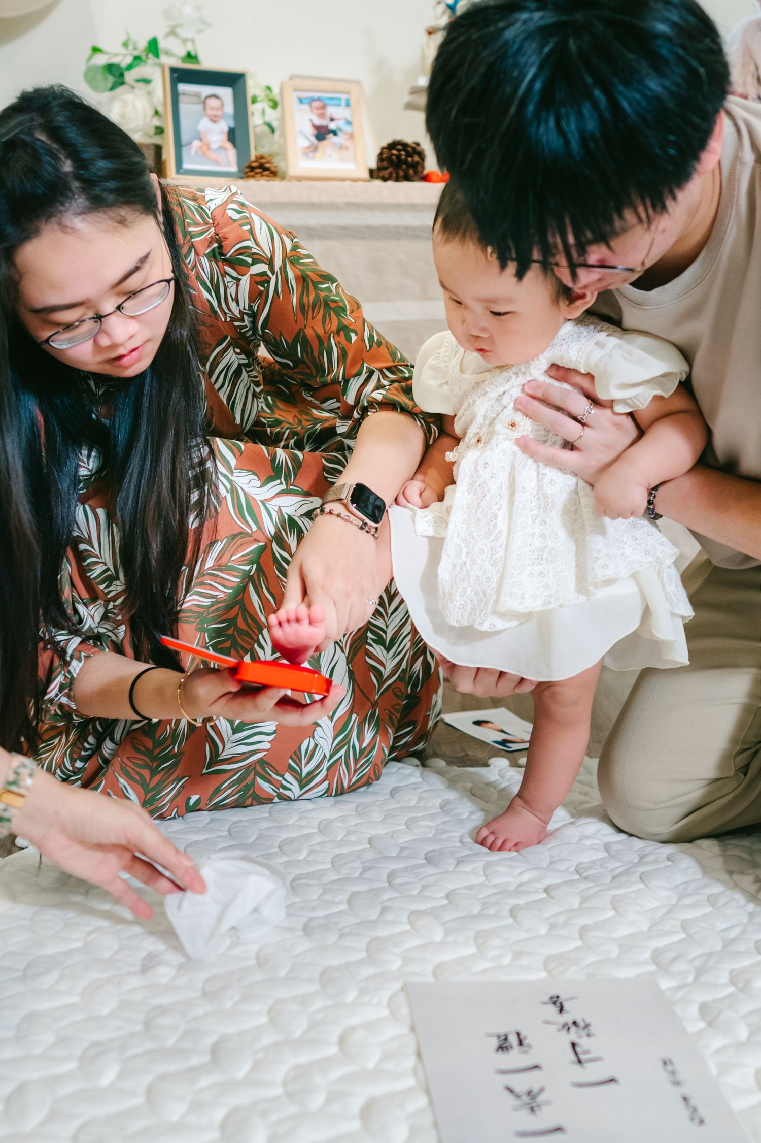 Five sequential photos showing someone practicing Chinese calligraphy on a white surface with a traditional brush.
