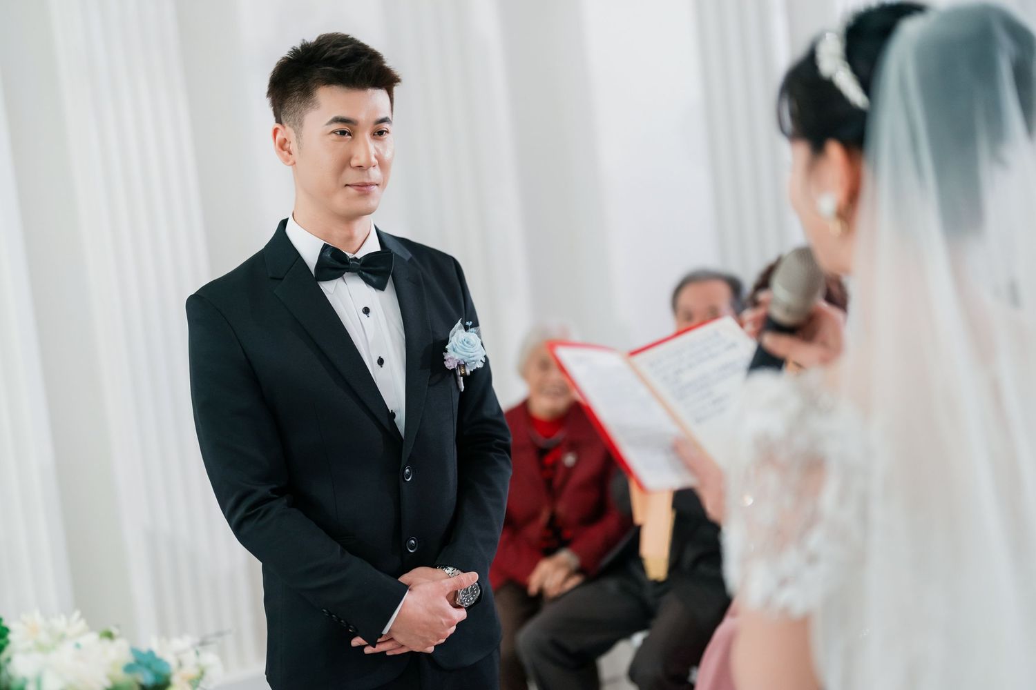A bride and groom share an emotional first look moment during their wedding ceremony.