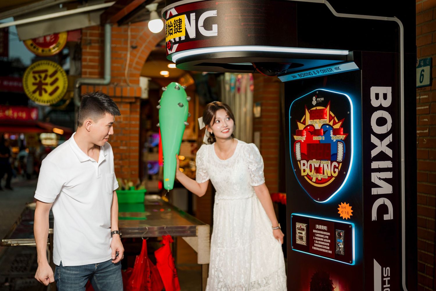 People enjoy a night out at a dimly lit bar with neon signs and glowing decorations in the background.