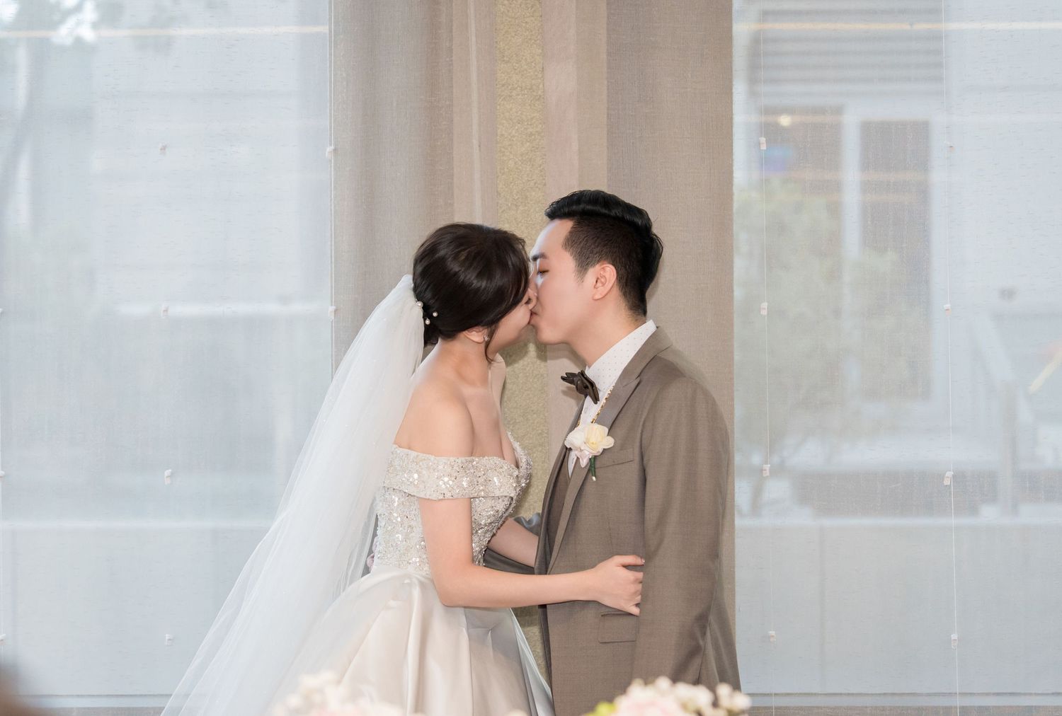 A bride and groom share romantic moments in a series of soft, dreamy wedding photos.