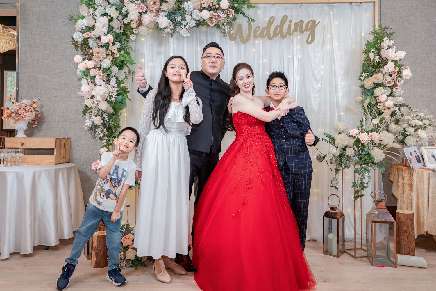 Wedding photo collage featuring couples in formal attire with red gowns and floral decorations against a gray backdrop.