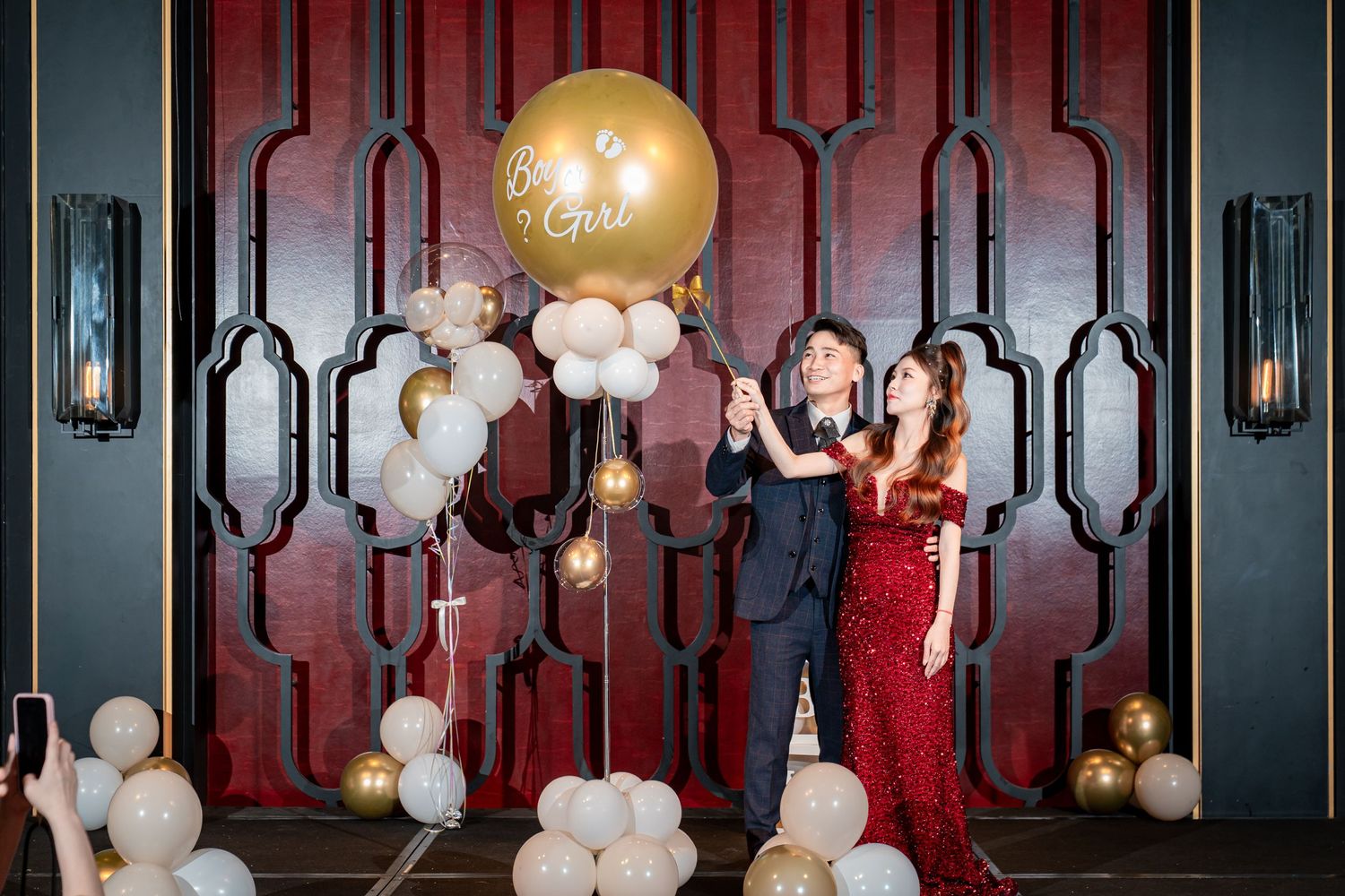 Elegant ballroom decorated with ornate mirrors, chandeliers, and white balloons for a luxurious event celebration.