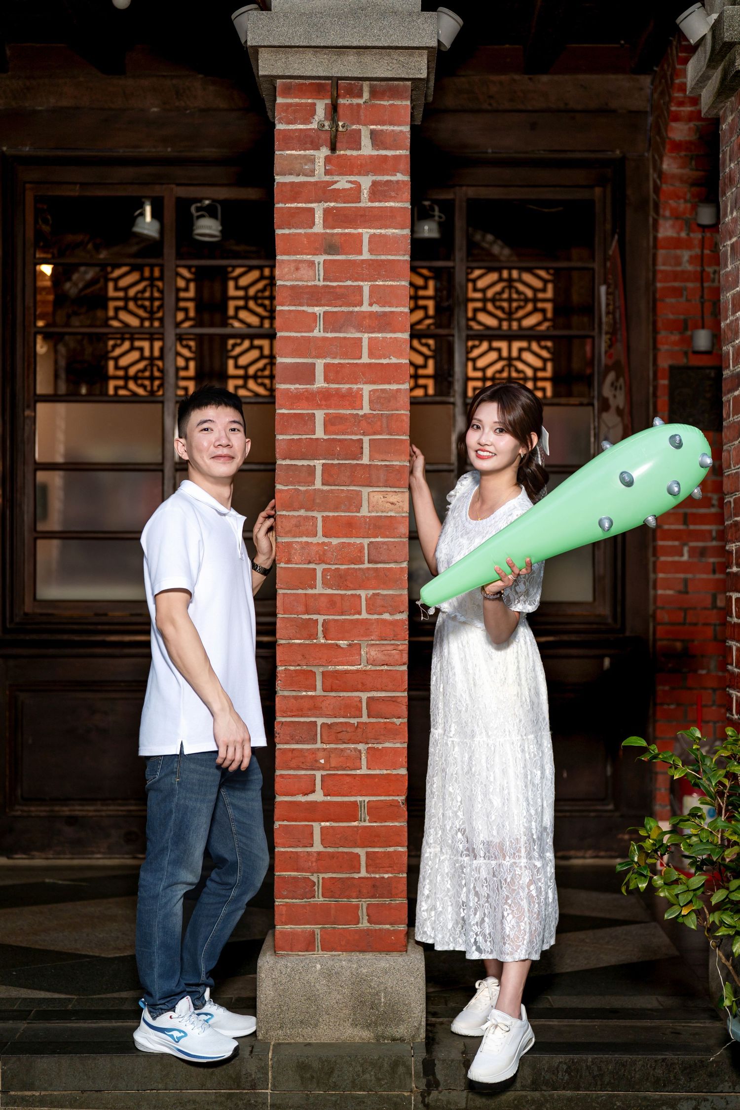 A series of playful poses on a brick porch with white trim and decorative window details.