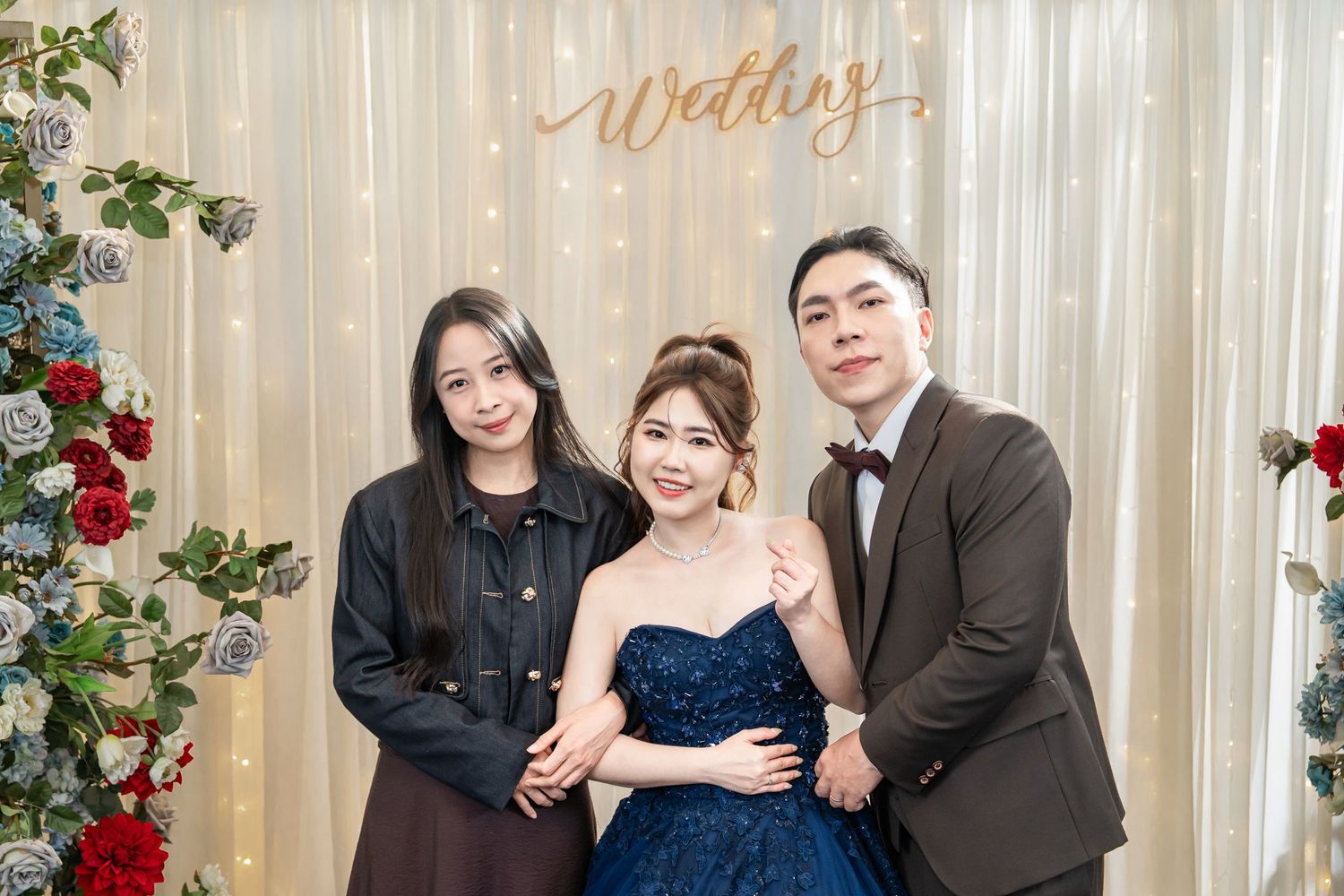 A series of formal event photos showing couples and groups posing against a light-colored backdrop with floral decorations.