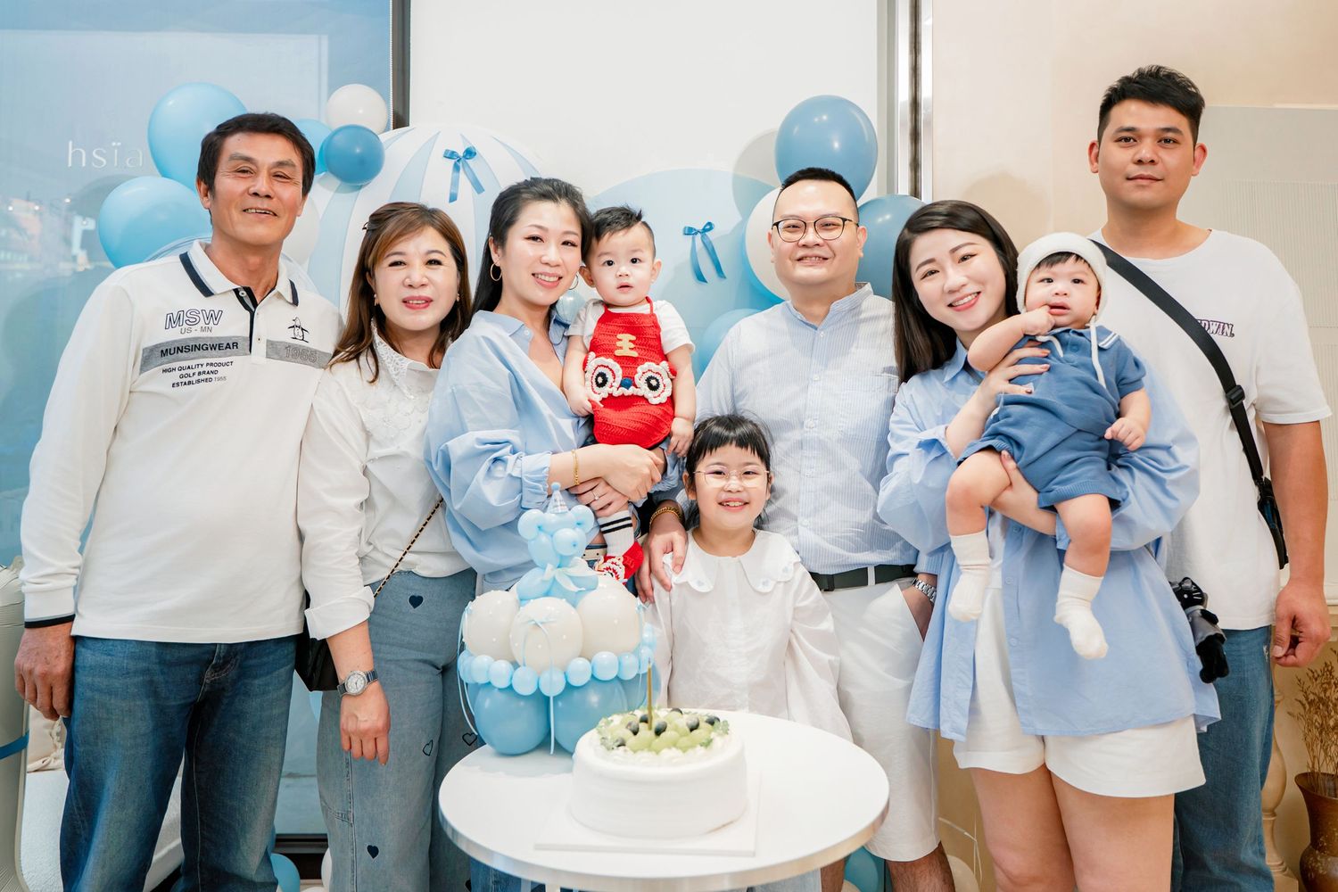 A series of family photos showing people celebrating a baby's first birthday party with cake and decorations.