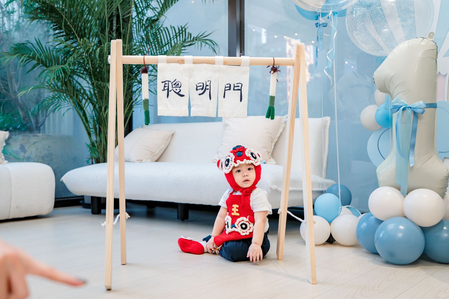 Soft pastel blue and white baby nursery decor with wooden furniture and plush toys creates a serene atmosphere.