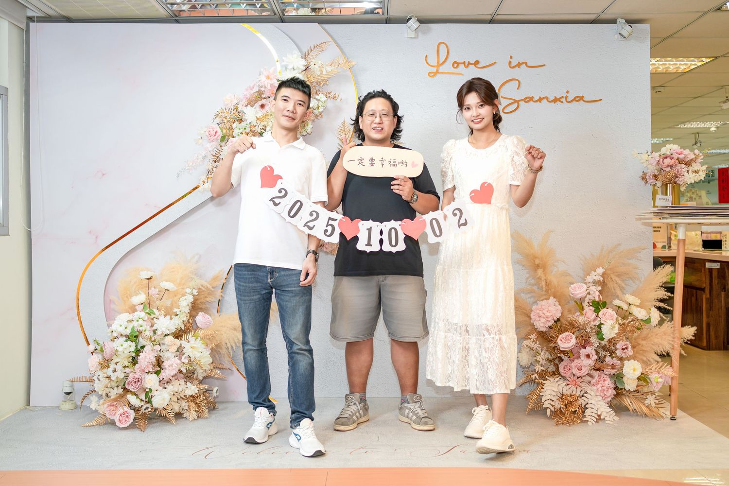 A series of five connected romantic engagement or wedding photos with pink floral decorations and neutral backgrounds.