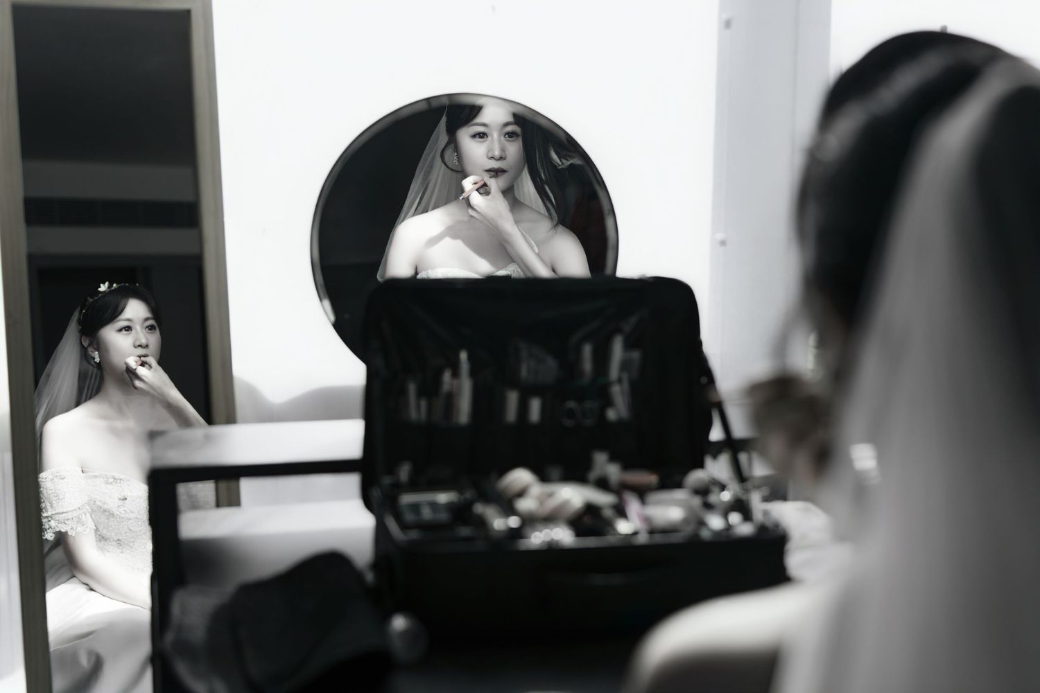 Black and white photo sequence showing someone getting ready in a mirror reflection with soft lighting and shadows.