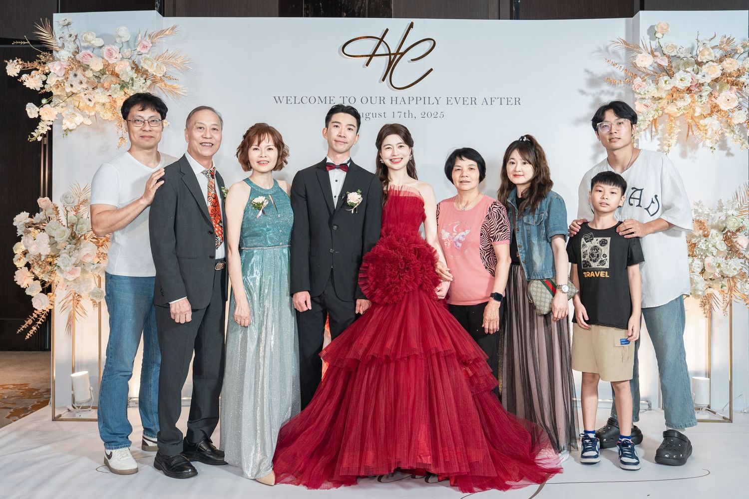 Group photos showing formal event attendees in elegant attire with beautiful cherry blossoms in the background.