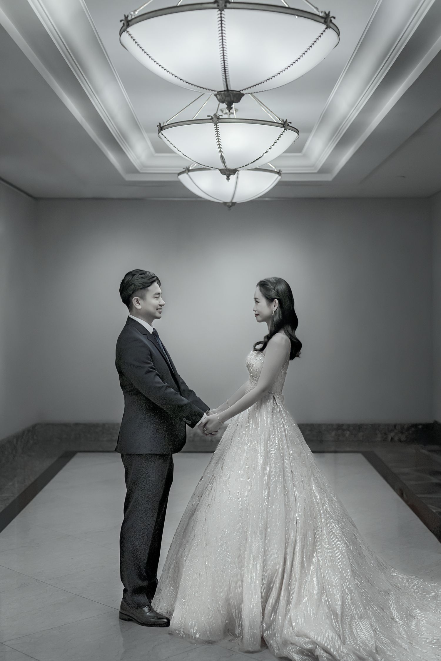 A wedding photo sequence showing a couple in formal attire dancing together under elegant ceiling lighting.
