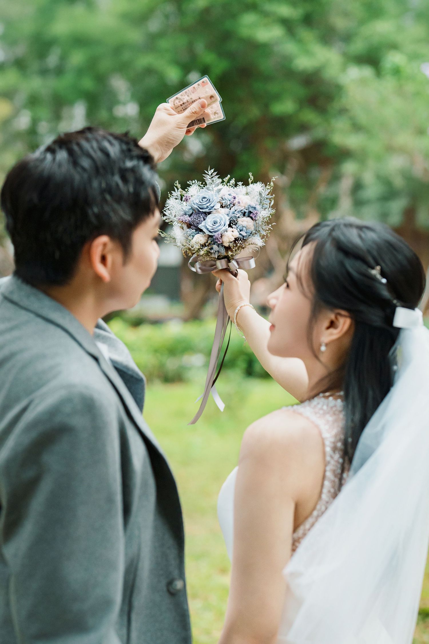 A sequence of wedding photos showing a couple in a garden setting adjusting their crowns and veils.