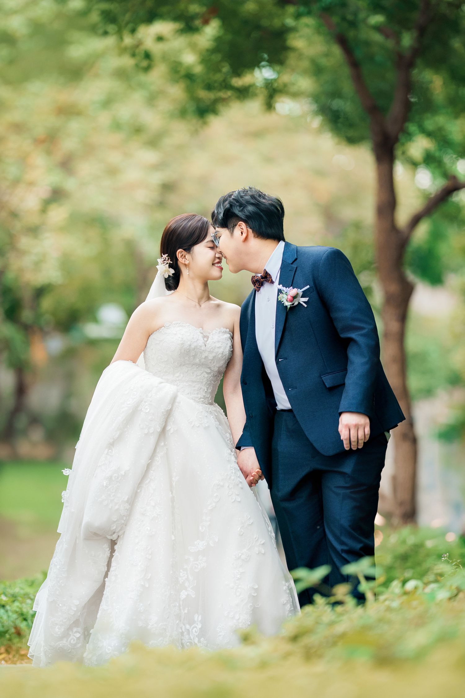 A romantic wedding couple shares intimate moments in a lush garden setting, captured in a series of soft, dreamy photos.