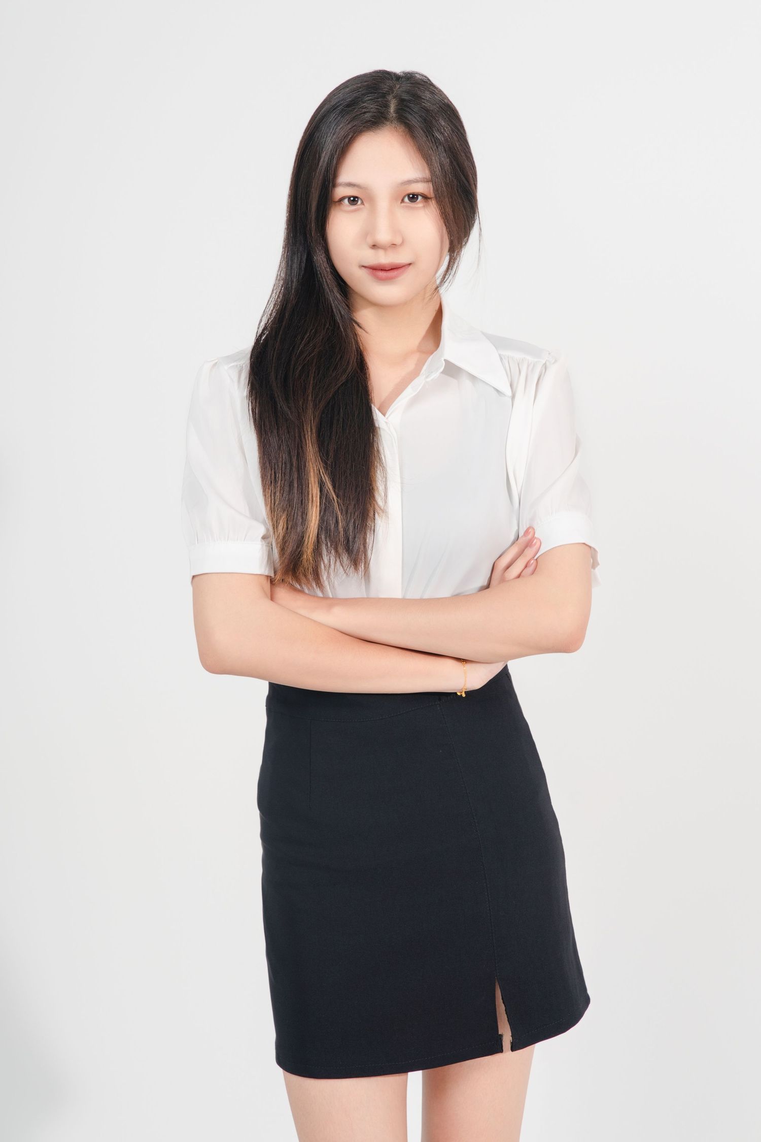 Woman in white button-down shirt and black skirt poses confidently against white background in four different poses.