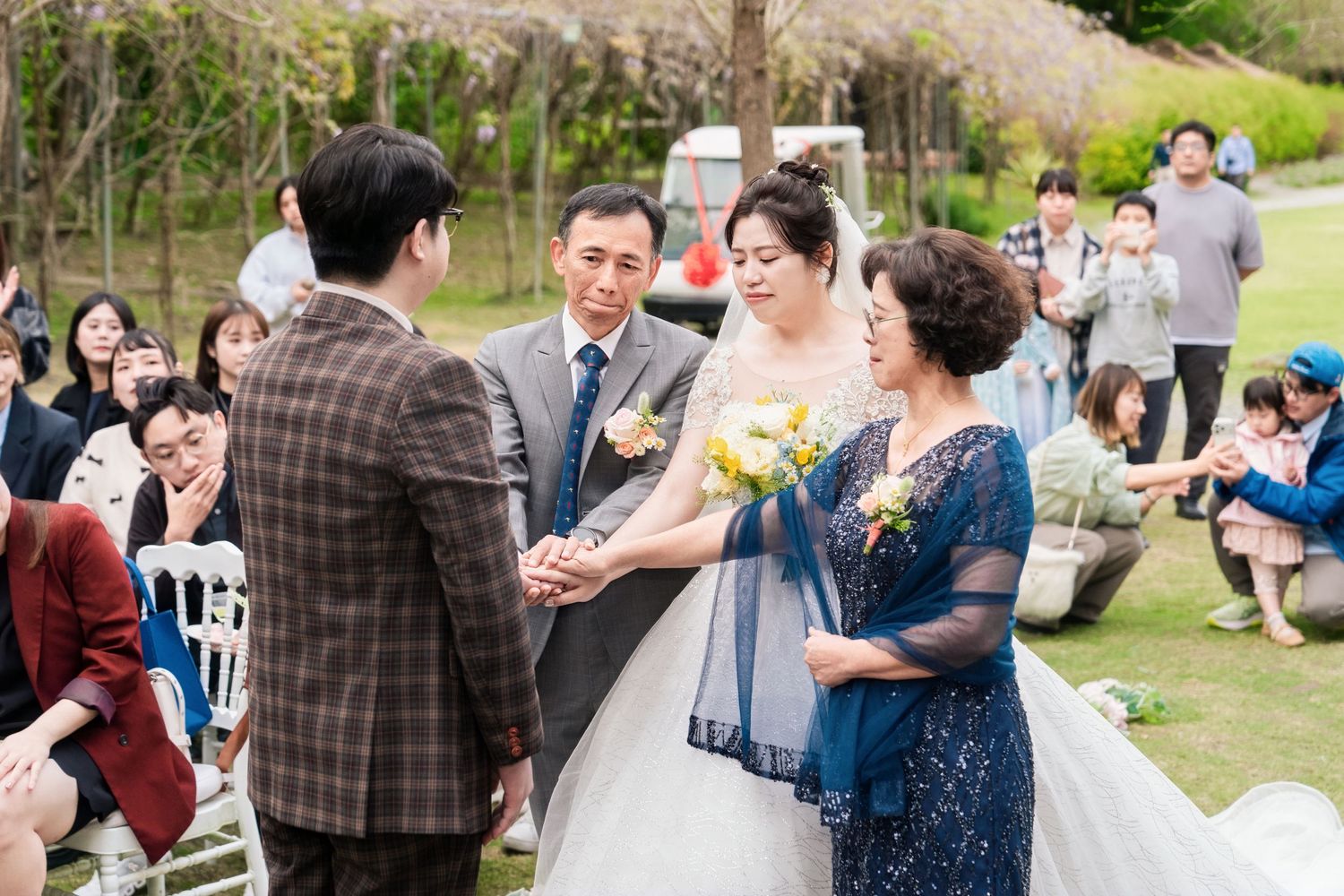 A series of candid moments captured during an outdoor wedding celebration with guests dancing and mingling.