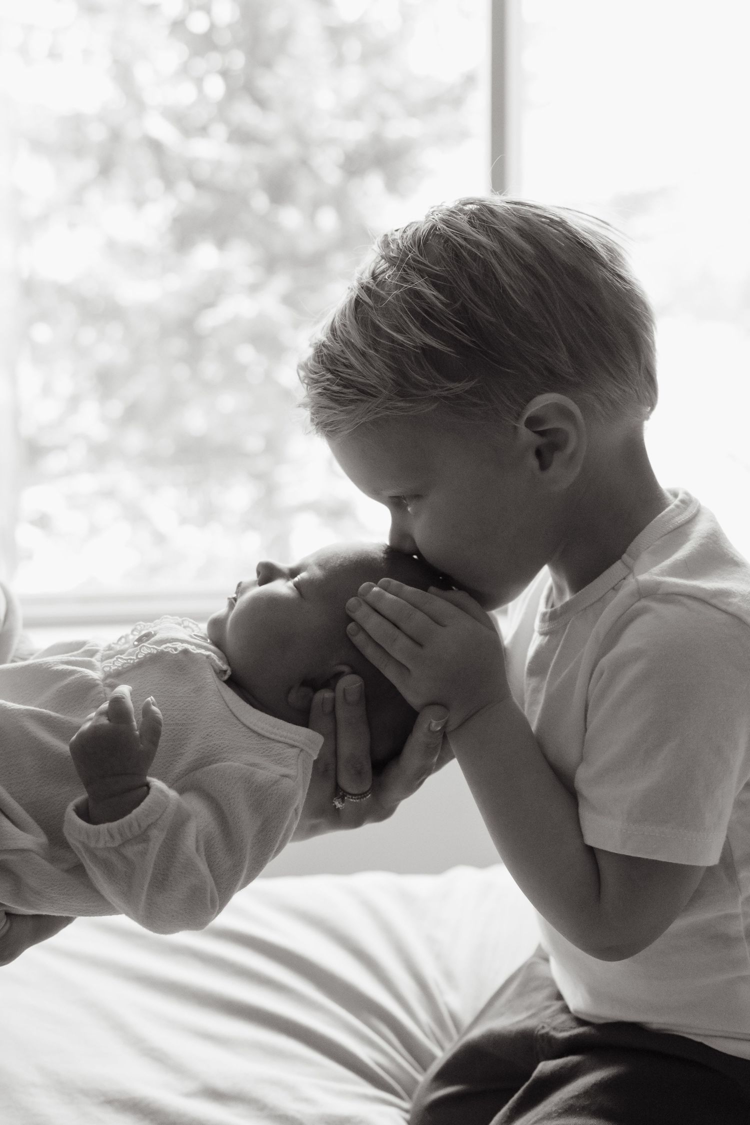 A black and white series of four images showing people blowing their noses with tissues.