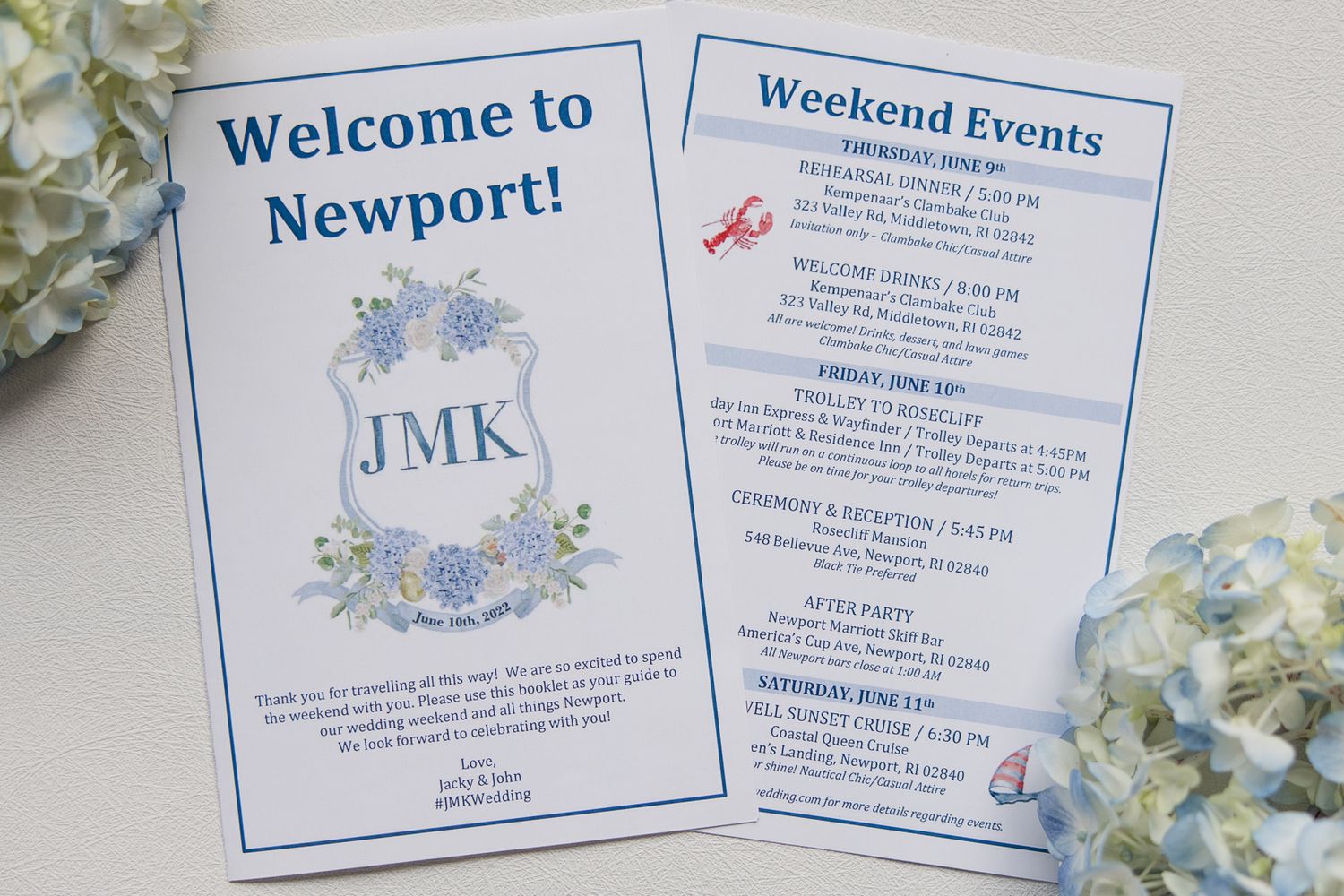 Blue and white wedding welcome cards with floral design and weekend event details.