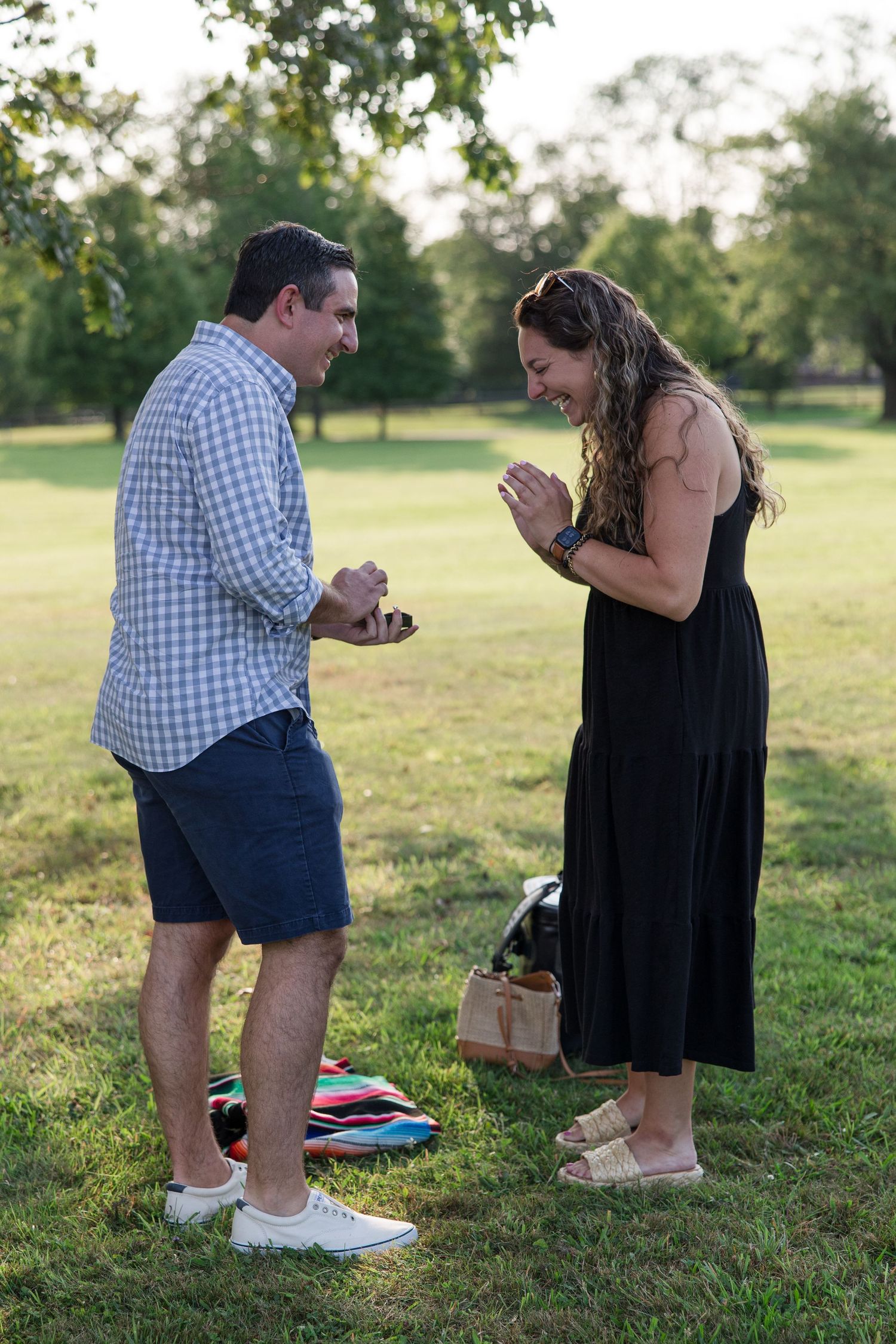 An emotional outdoor scene with two people sharing a special moment in a park.