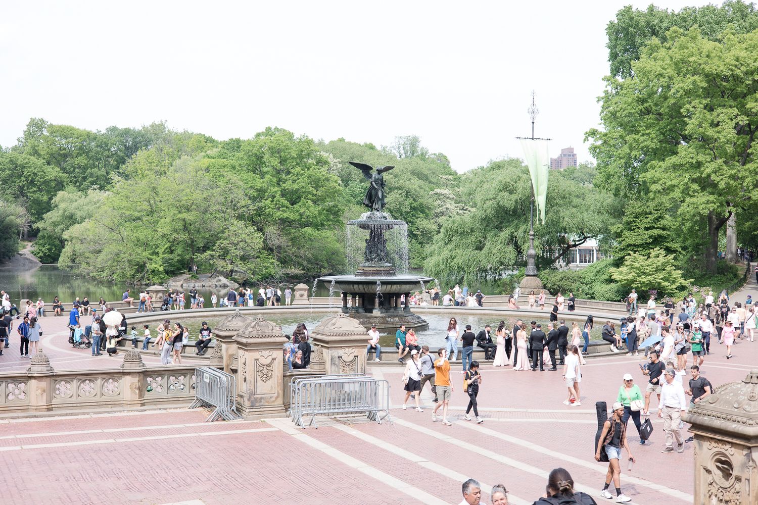 Bethesda Fountain and Terrace in Central Park with tourists enjoying a sunny day.