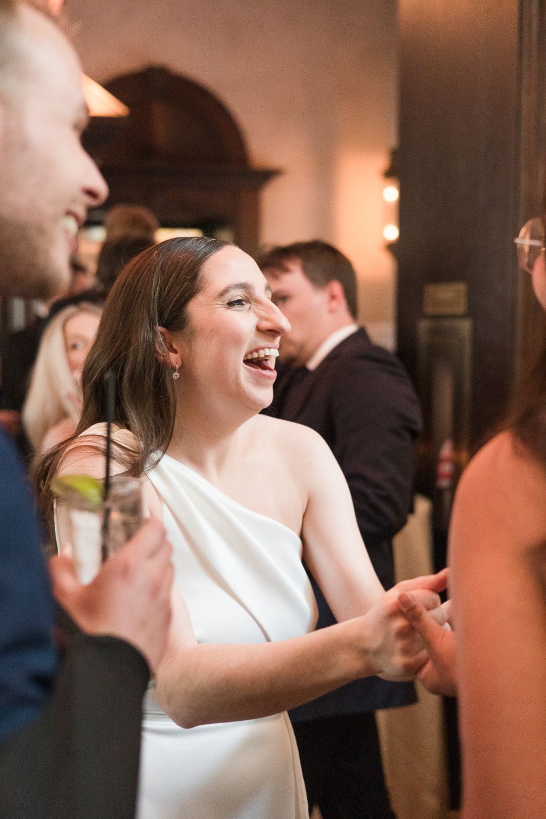 A candid moment of joy and laughter during a wedding celebration.