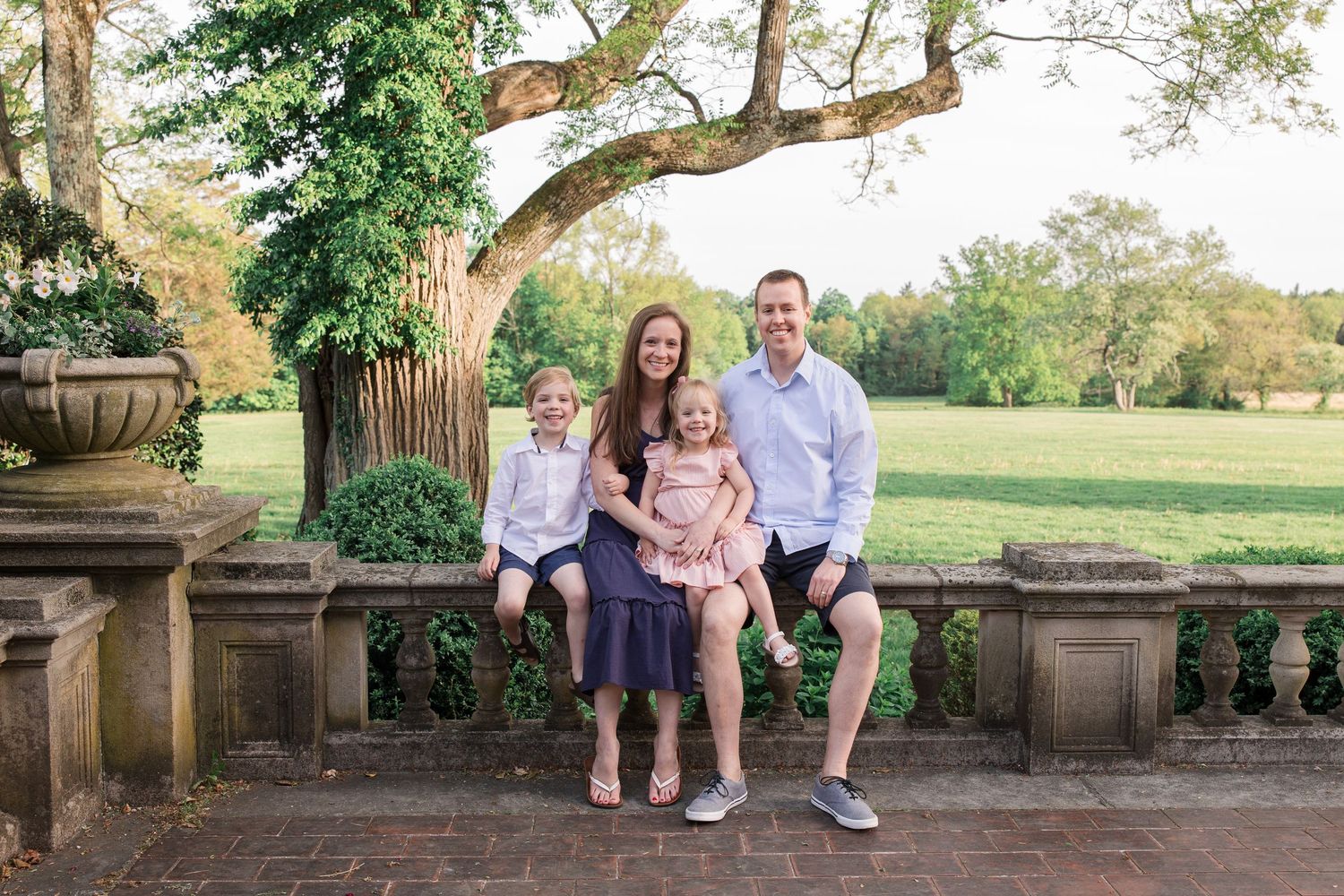 A Ridgefield, CT family stands for a family photography session at Waveny Park with a Ridgefield Family Photographer.