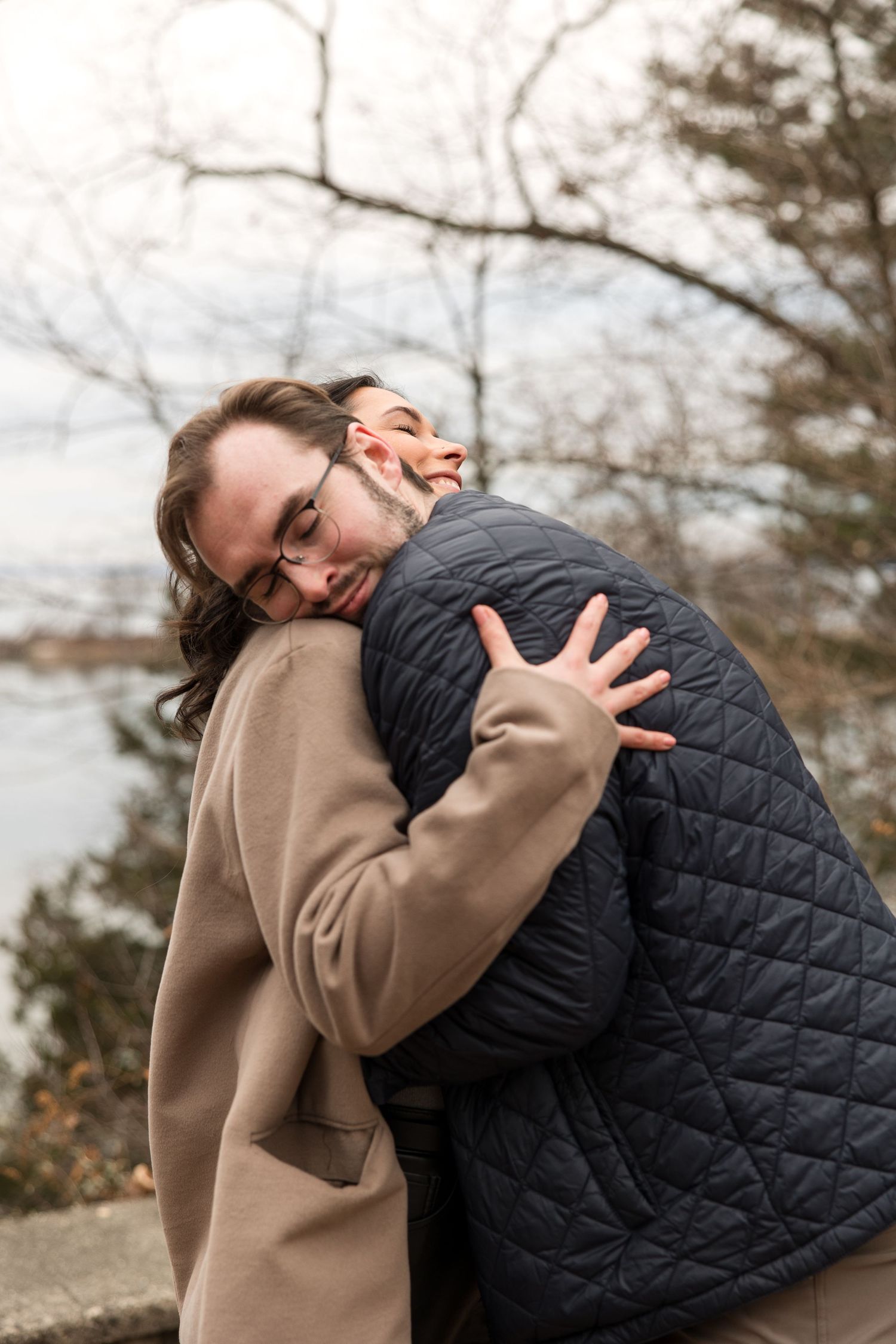 A candid moment of joy and laughter shared during an outdoor photo session.