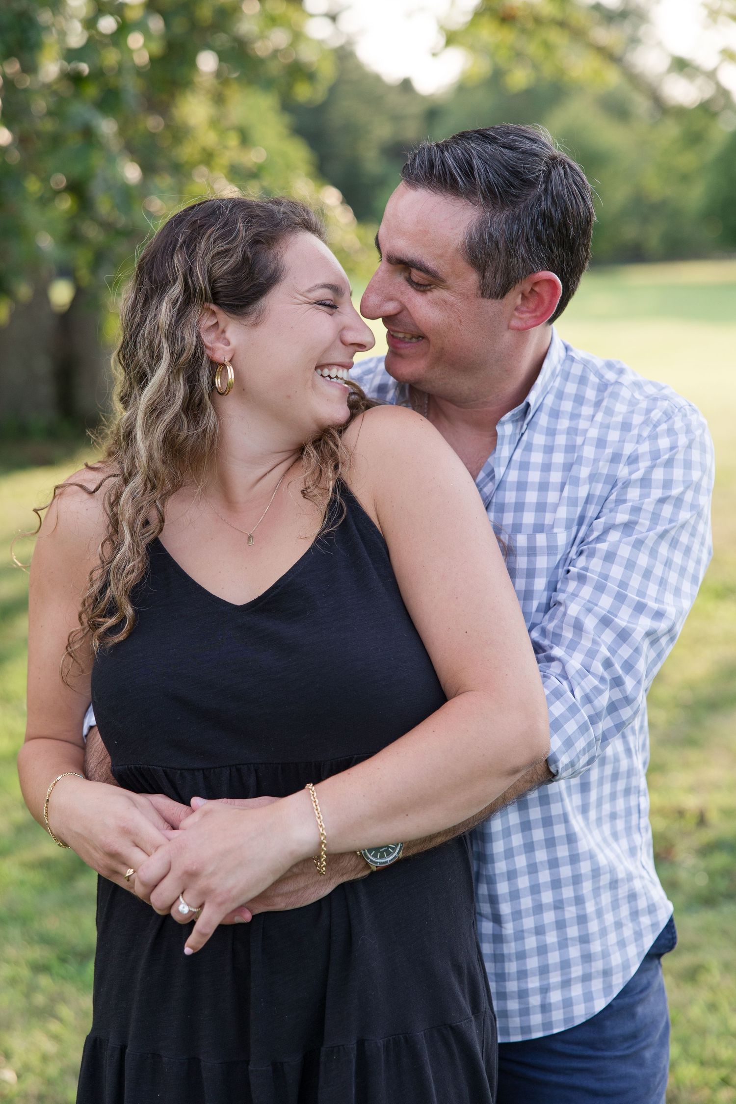 A couple sharing a joyful moment together outdoors.