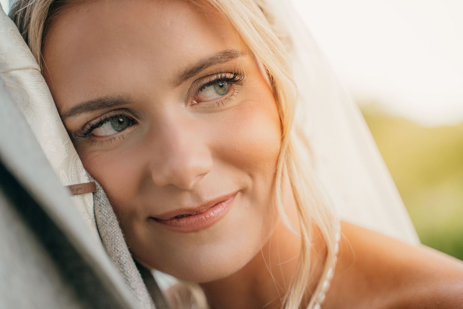 Bride resting her head on the groom at The gardeners country inn, captured by a candid wedding photographer.