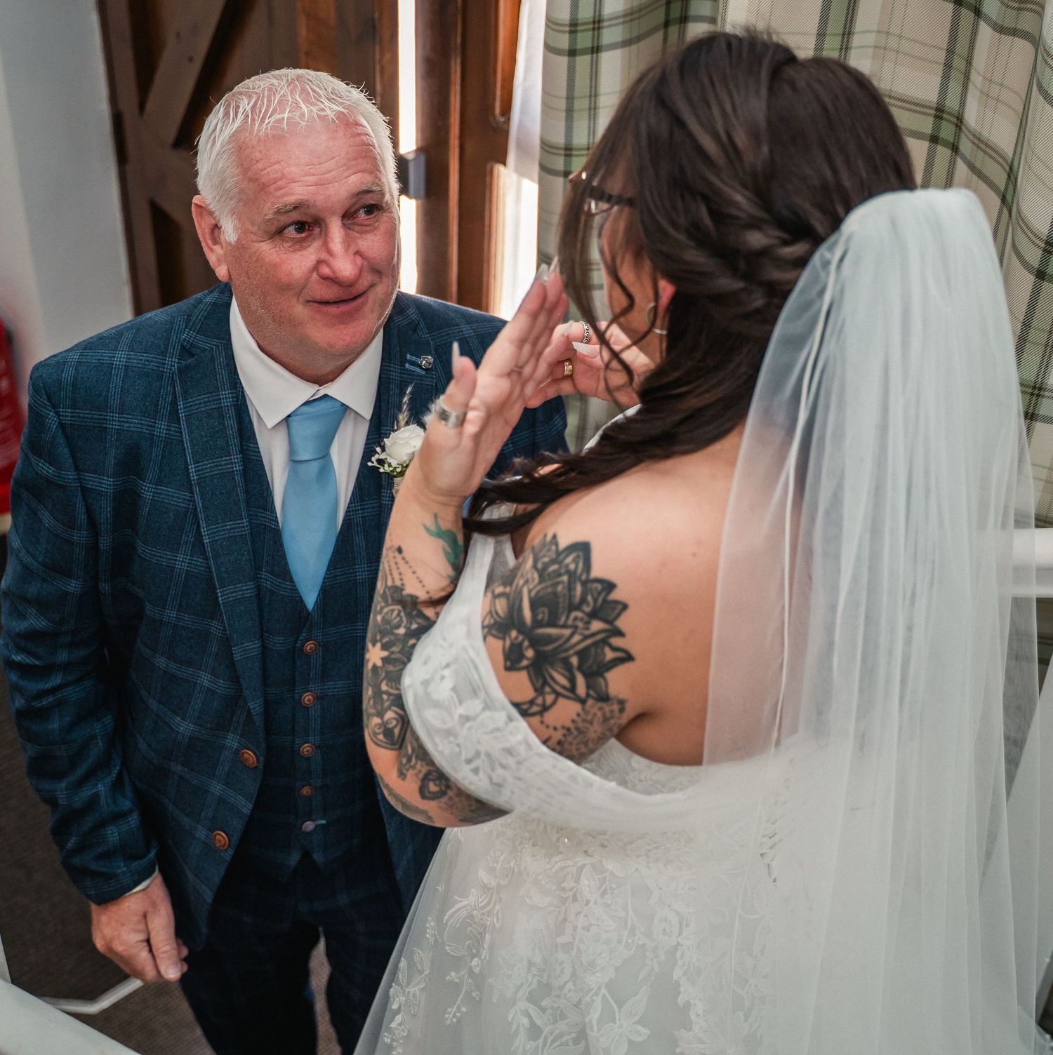 Brides first look with her dad at the Gardeners country inn, captured by a candid East Yorkshire wedding Photographer