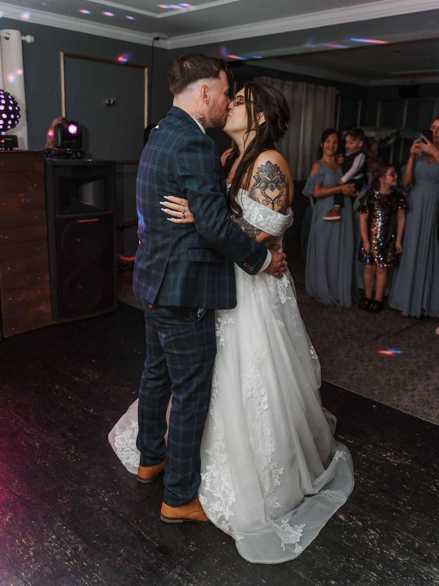 Bride and groom kissing during first dance at The gardeners country inn, captured by a wedding photographer in East Yorkshire