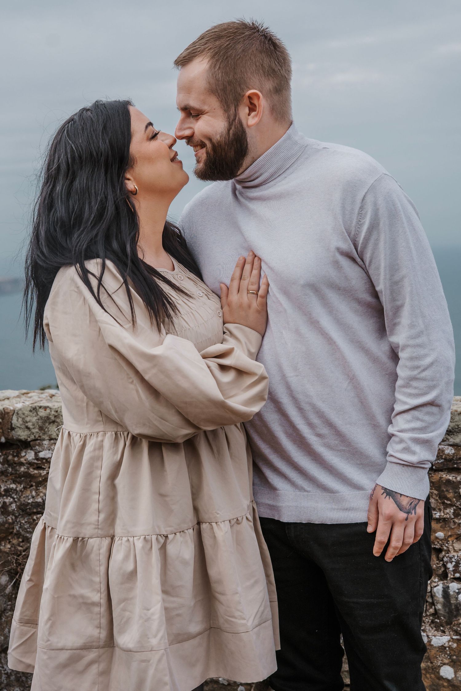 couple kissing during their engagement shoot, taken by a Yorkshire wedding photographer at Grand villa heights