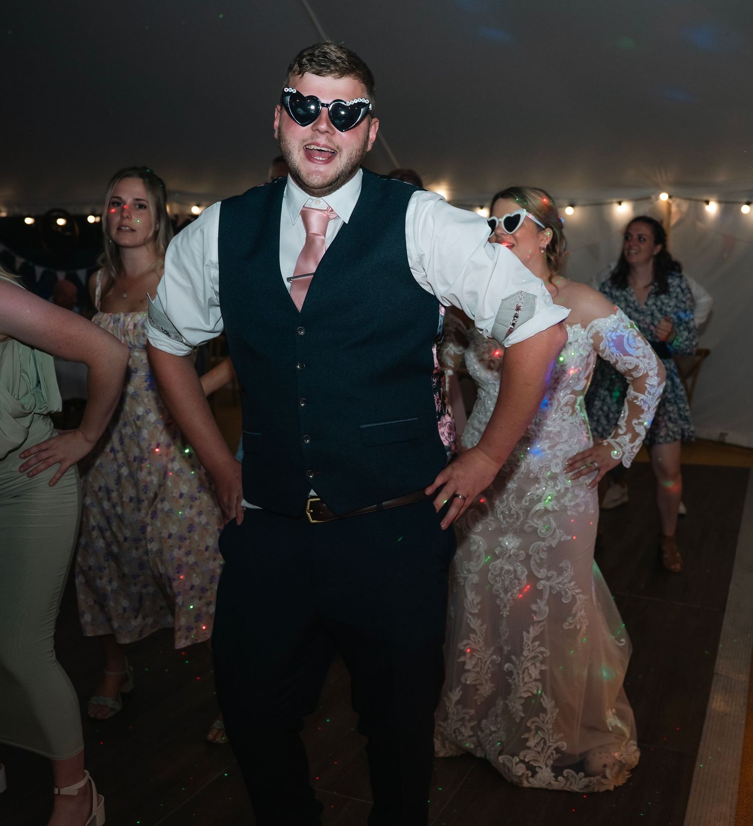 Groom dancing away, captured by East Yorkshire wedding photographer.