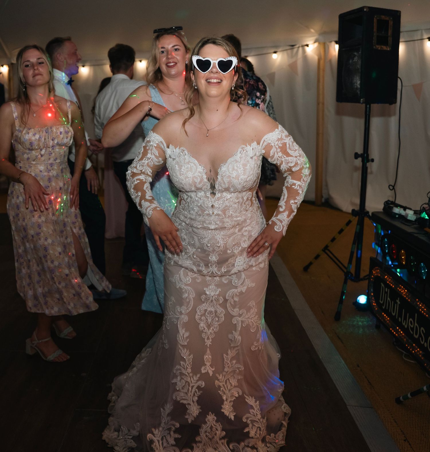 Bride dancing wearing white glasses during their tipi wedding, captured by East yorkshire wedding Photographer