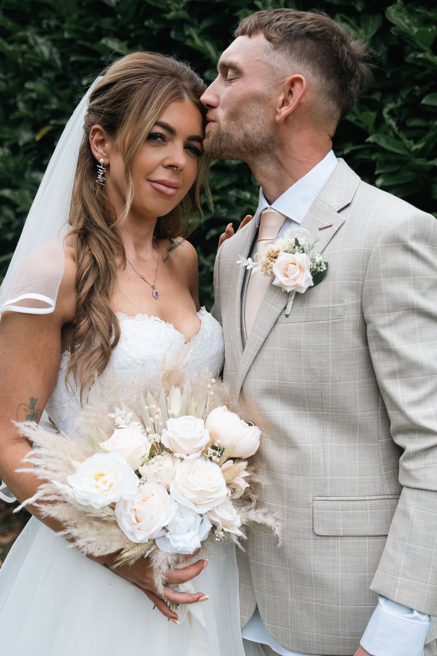 Bride and groom sharing a kiss at Lazaat hotel in Cottingham