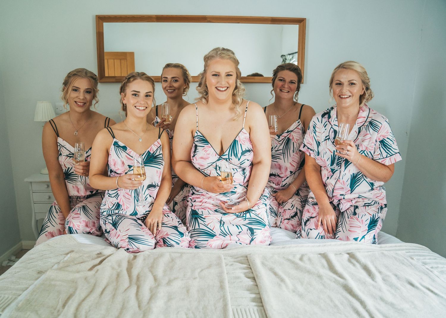Bride and bridesmaids in pjs at Barff house country weddings, captured by a candid wedding photographer.