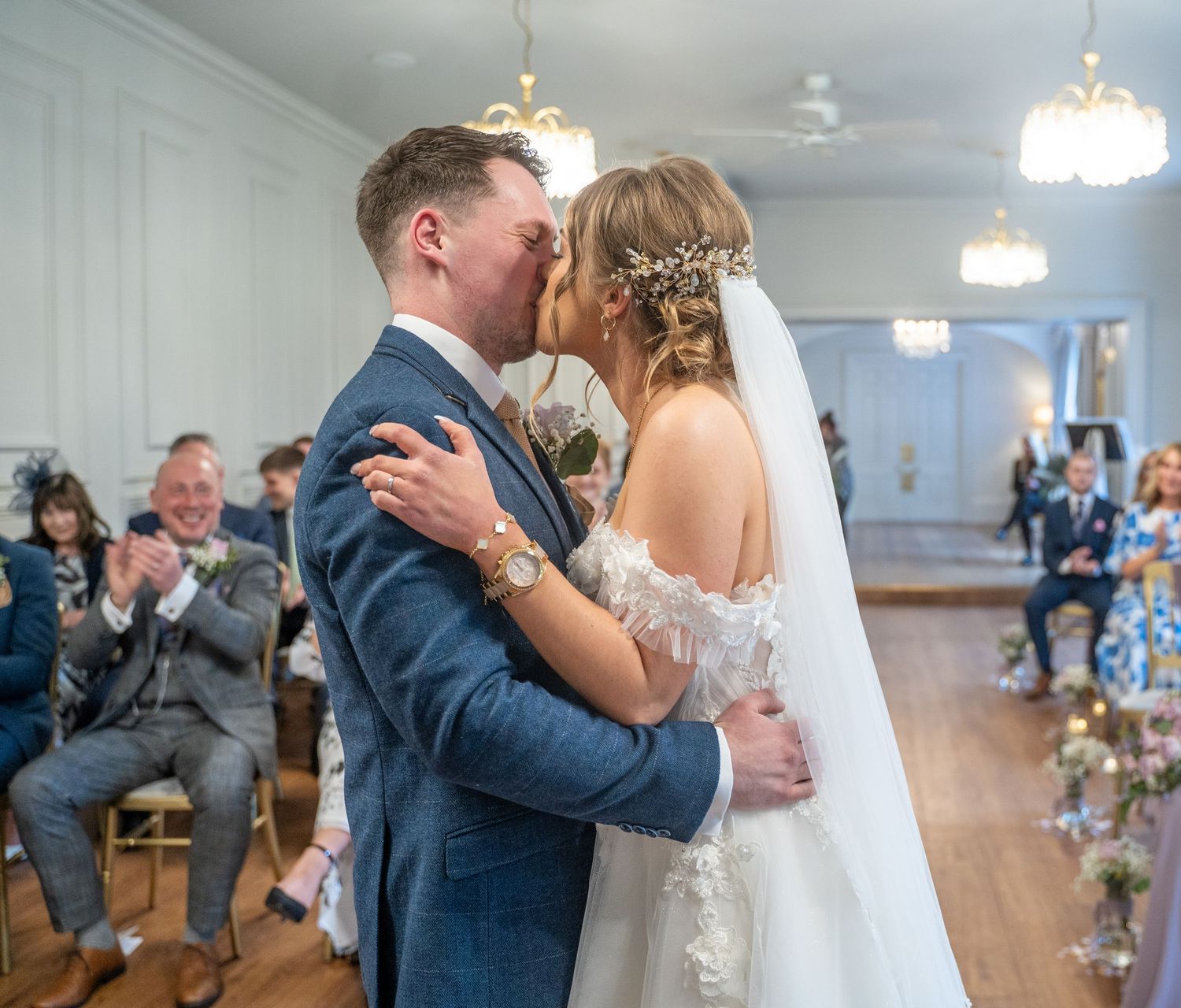 Bride and grooms first kiss as Mr and Mrs at Dunedin country house, captured by a documentary style wedding photographer in Hull