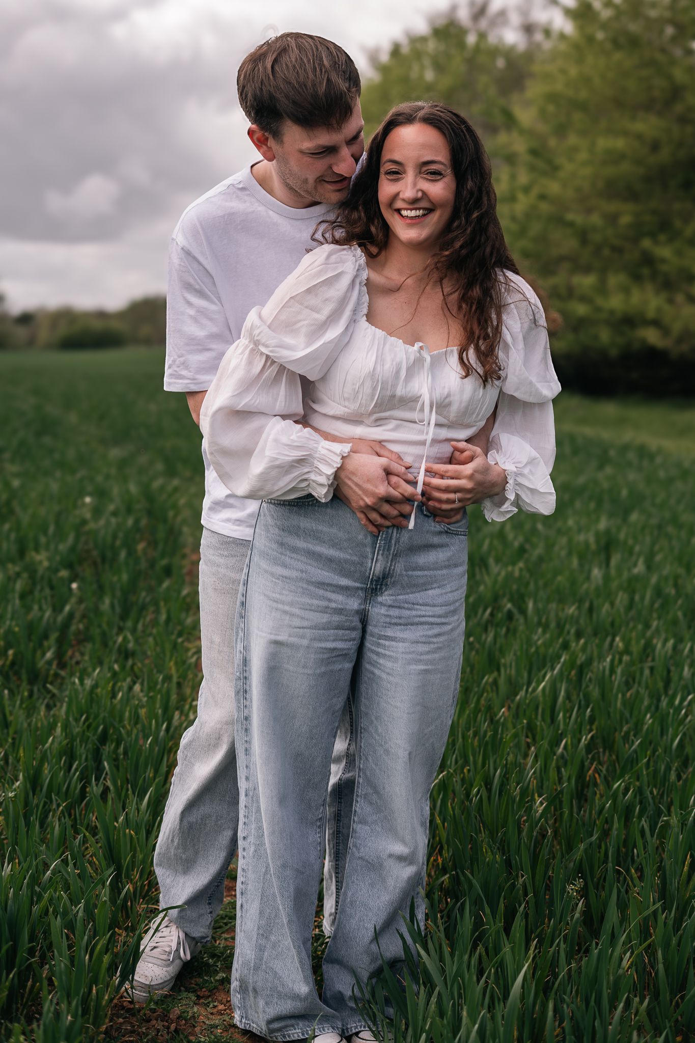 couple laughing and having fun during their engagement shoot, taken by a Yorkshire wedding photographer In east Yorkshire