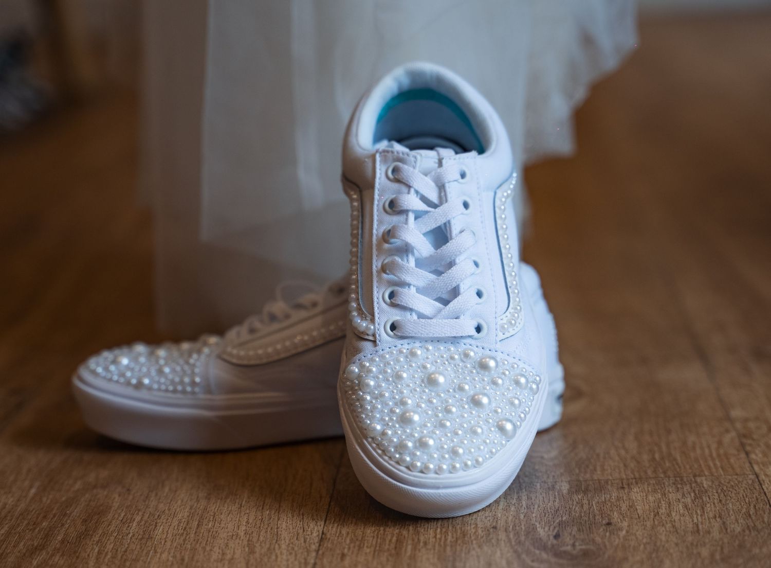 Brides converse at Little Wold Vineyard, captured by a documentary style photographer in East Yorkshire