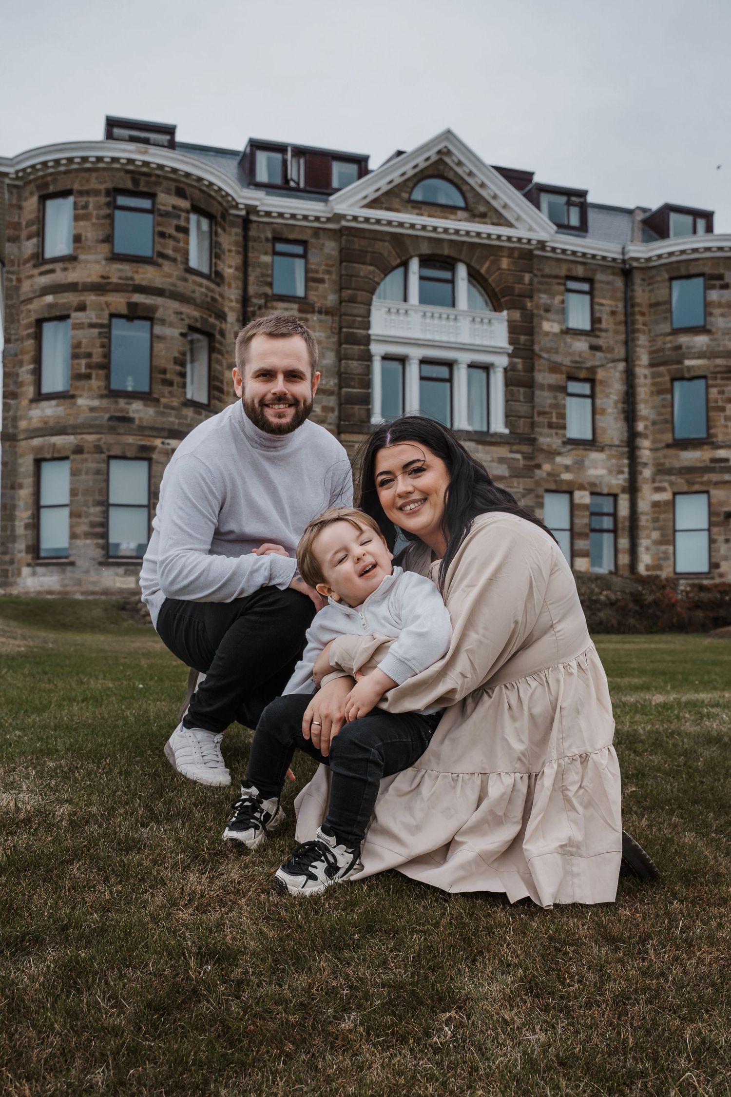Couple smiling during their engagement shoot, taken by a Yorkshire wedding photographer at Grand villa heights
