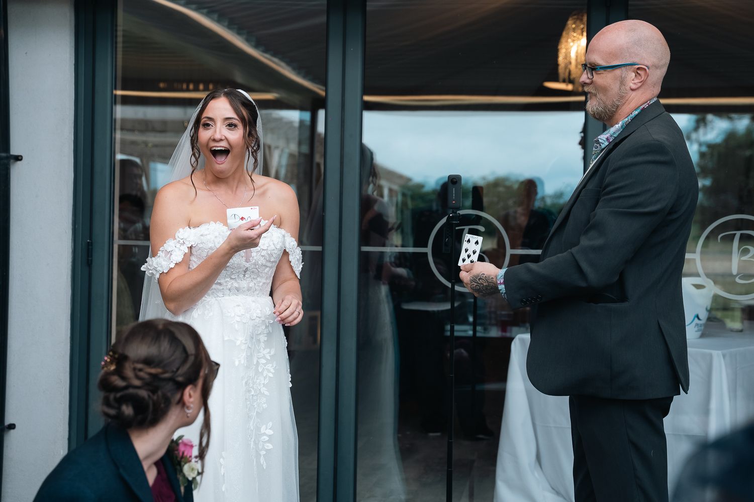 Bride reacting with surprise to the magician at The Barn at Willerby.