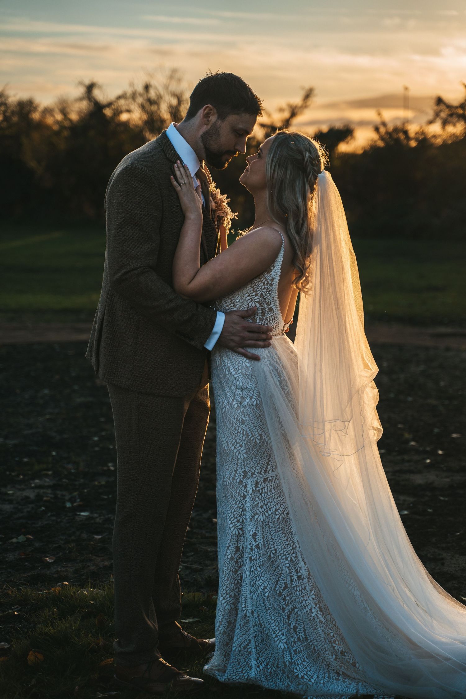 Bride and groom at The Triton Inn, brough during golden hour, captured by a candid wedding photographer in Yorkshire