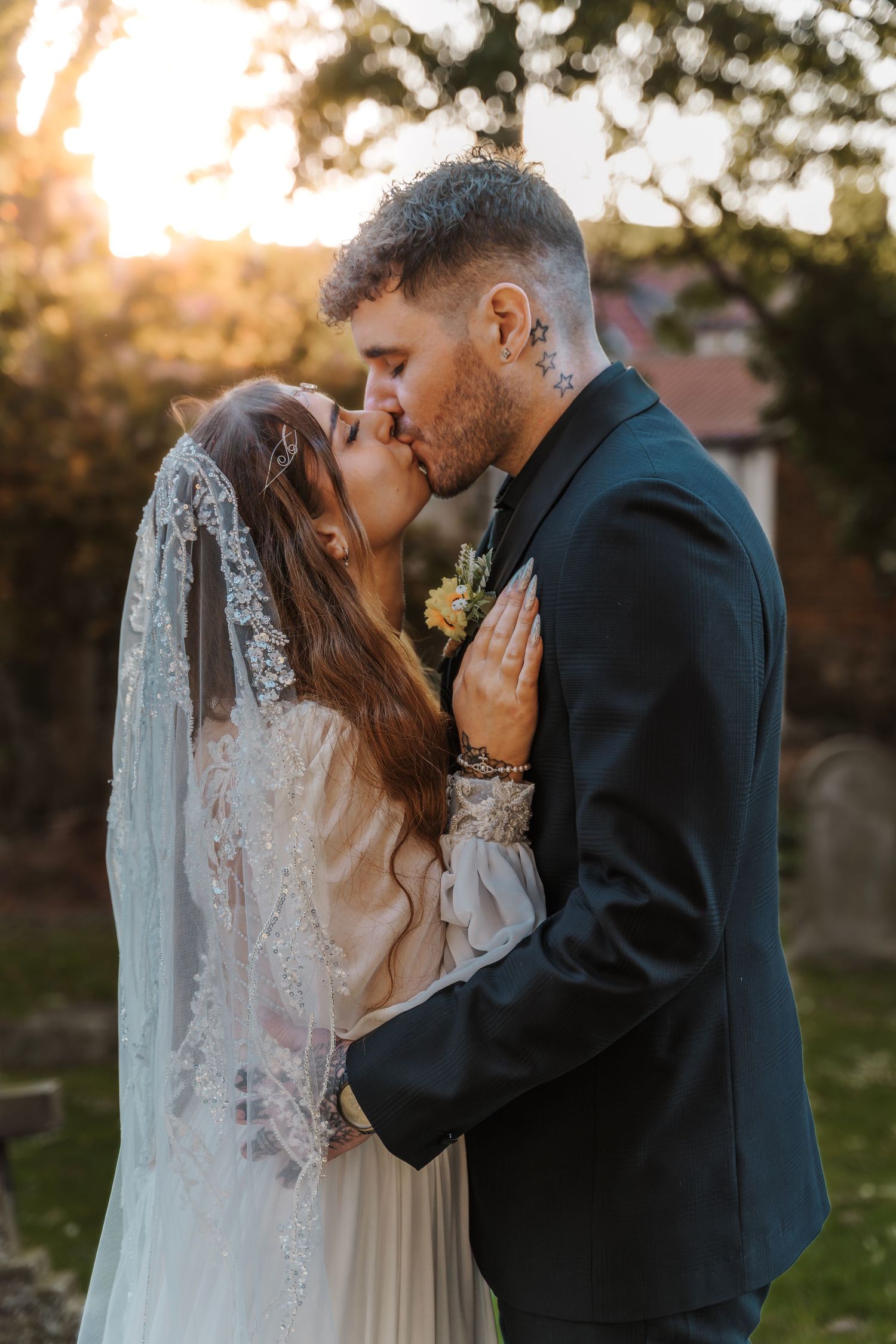 Hornsea wedding couple sharing a kiss at Sunset at st Nicholas church Hornsea