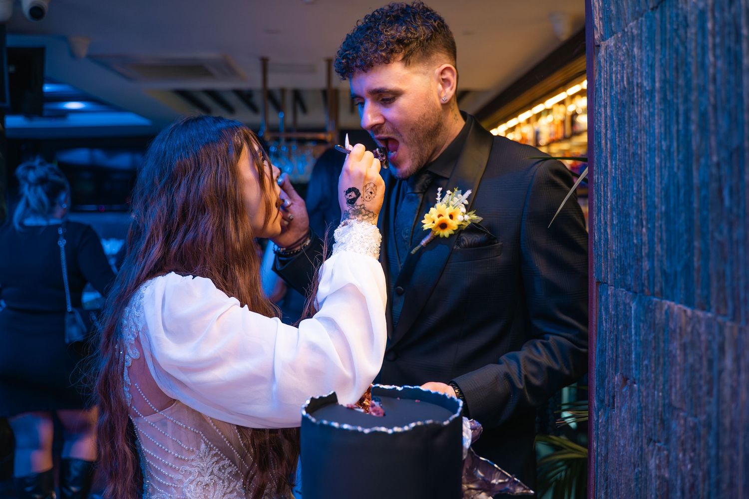Couple sharing a cake, taken by a wedding photographer in Hornsea east Yorkshire