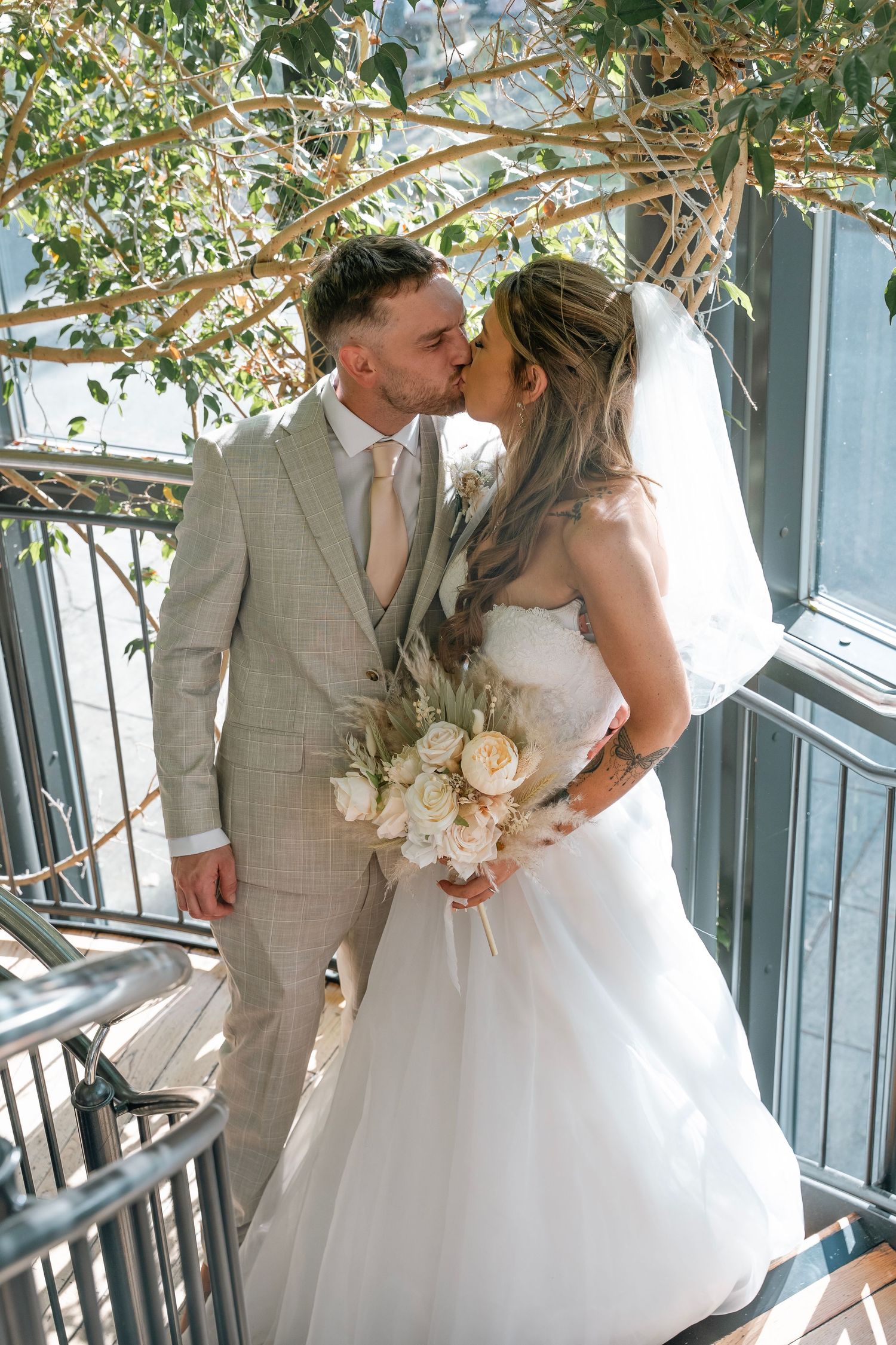 Bride and groom sharing a kiss at Lazaat hotel in Cottingham